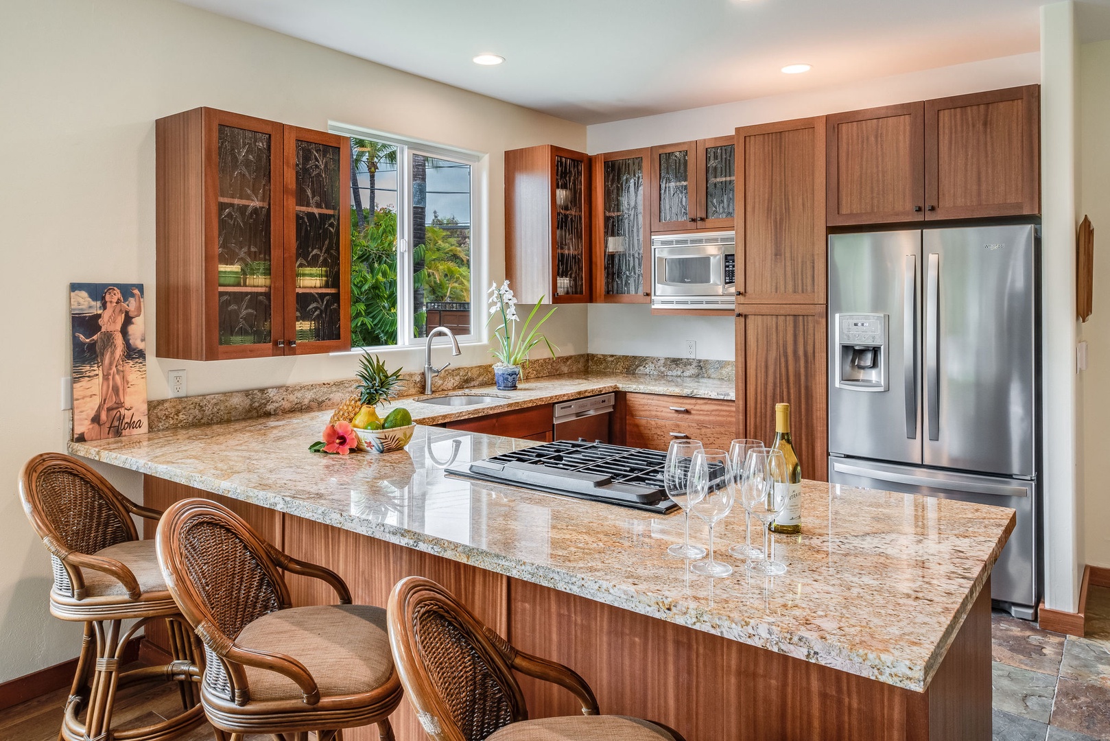 Kailua Kona Vacation Rentals, Kona Beach Bungalows** - Savor the fusion of function and style in the Honu kitchen, boasting expansive countertops and top-tier appliances.