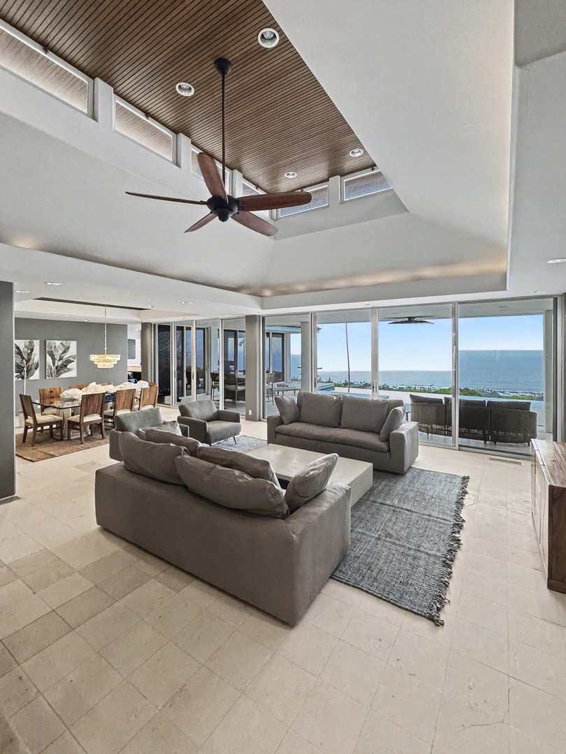 Kailua Kona Vacation Rentals, Hale Nai'a - Unwind in your expansive living room with panoramic ocean views stretching to the horizon through floor-to-ceiling windows.