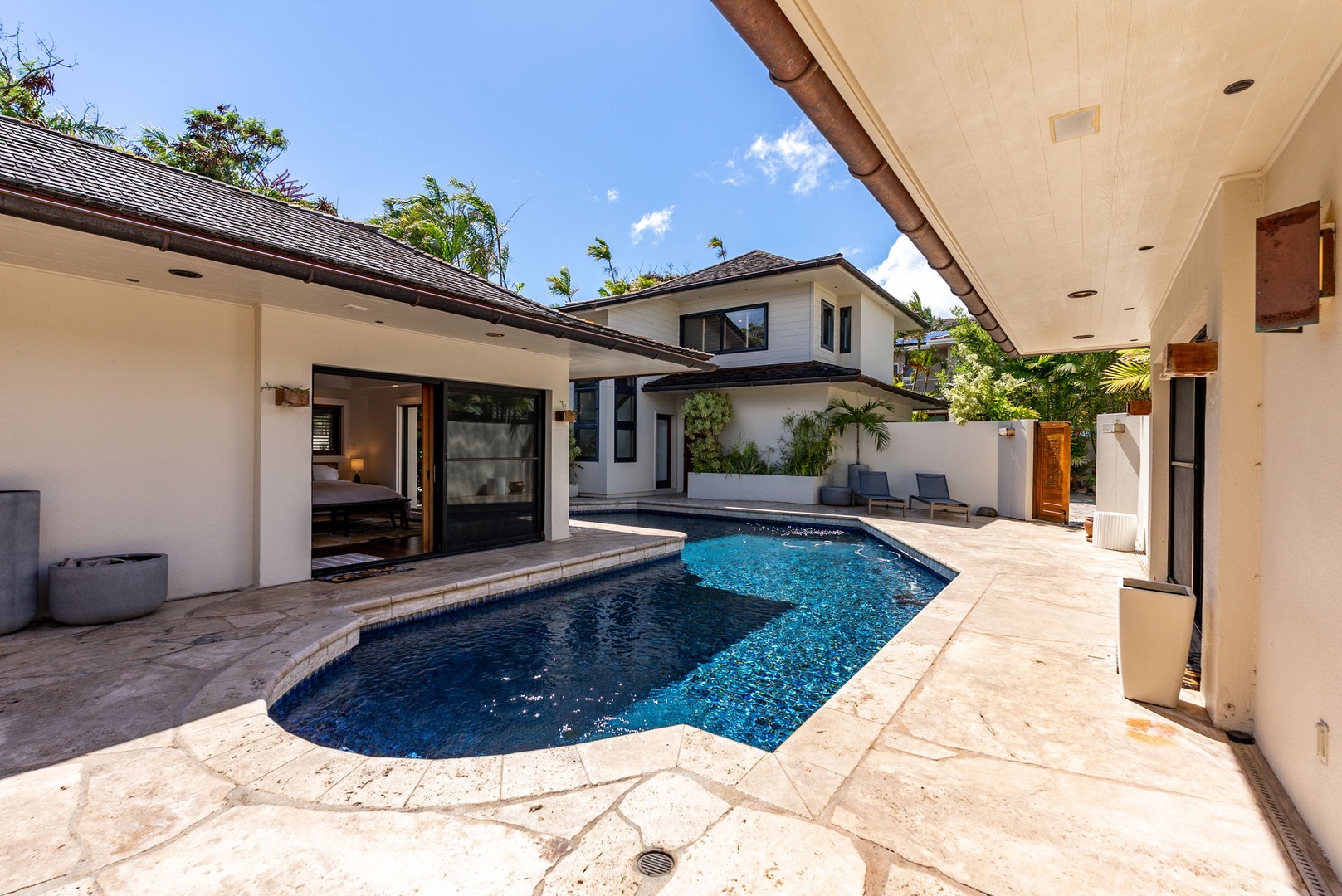 Honolulu Vacation Rentals, The Lagoon House 3BR - The seamless flow includes the inviting blue pool waters.