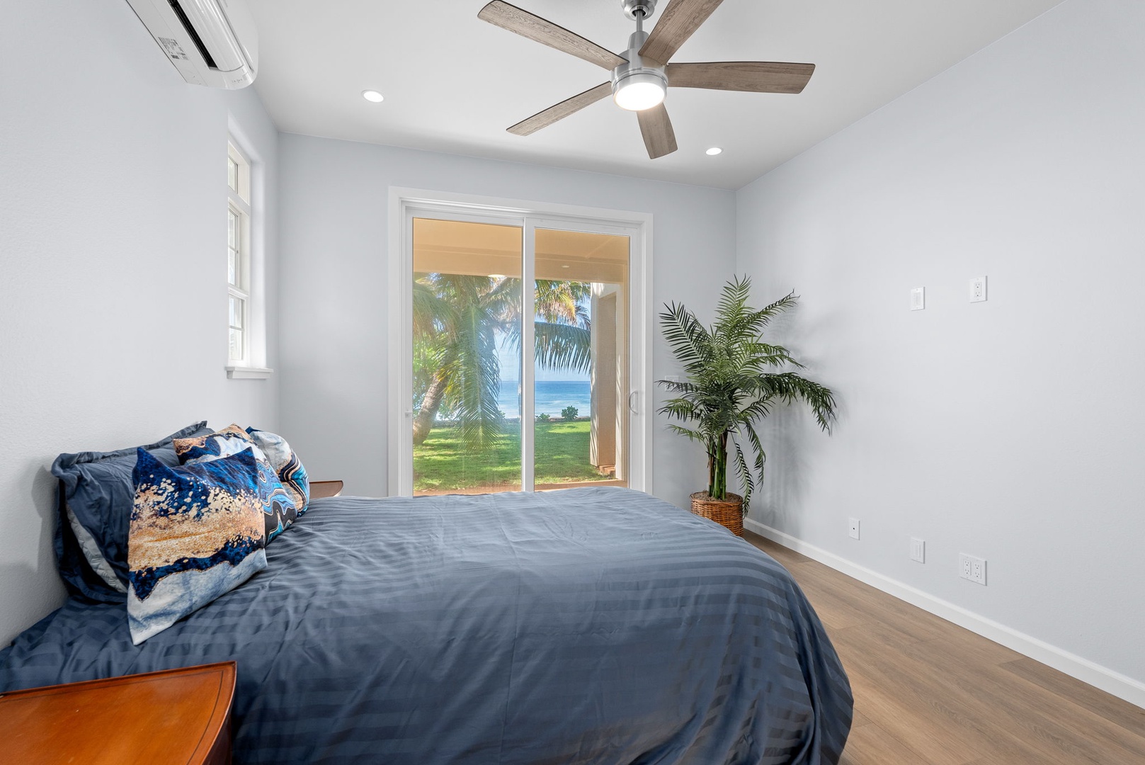Waianae Vacation Rentals, Oceanfront Luxury Dream Estate - This guest suite opens to a private lanai—offering fresh air, palm views, and true indoor-outdoor living.
