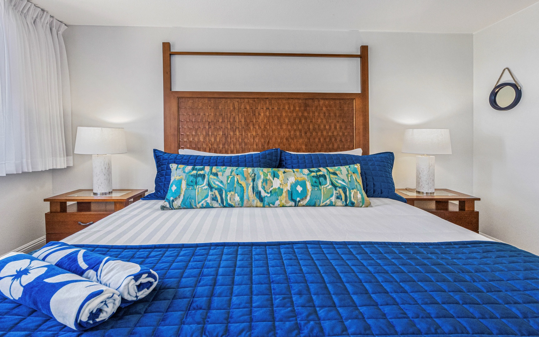 Lahaina Vacation Rentals, Royal Kahana 213 - The king bed in the primary bedroom offers plush bedding and vibrant accents, perfect for a restful night's sleep.