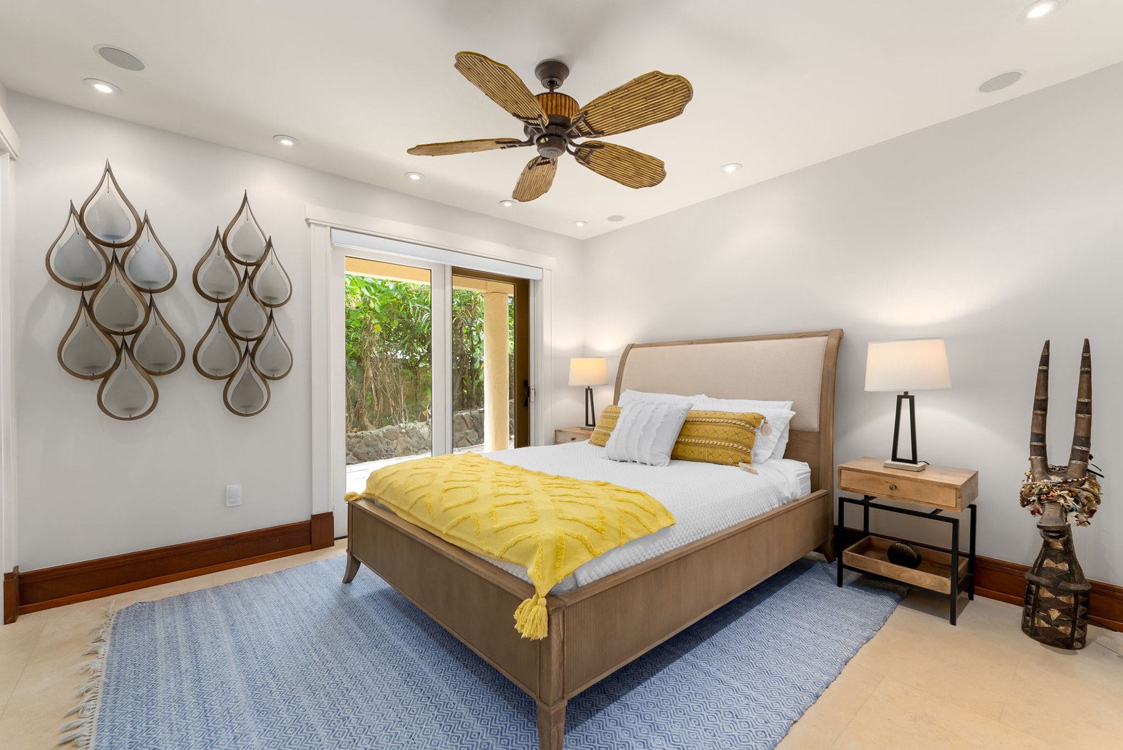 Kailua Vacation Rentals, Leaf House - Sink into crisp linens and tropical warmth as golden accents and a gentle ceiling fan create your peaceful island retreat with garden views.
