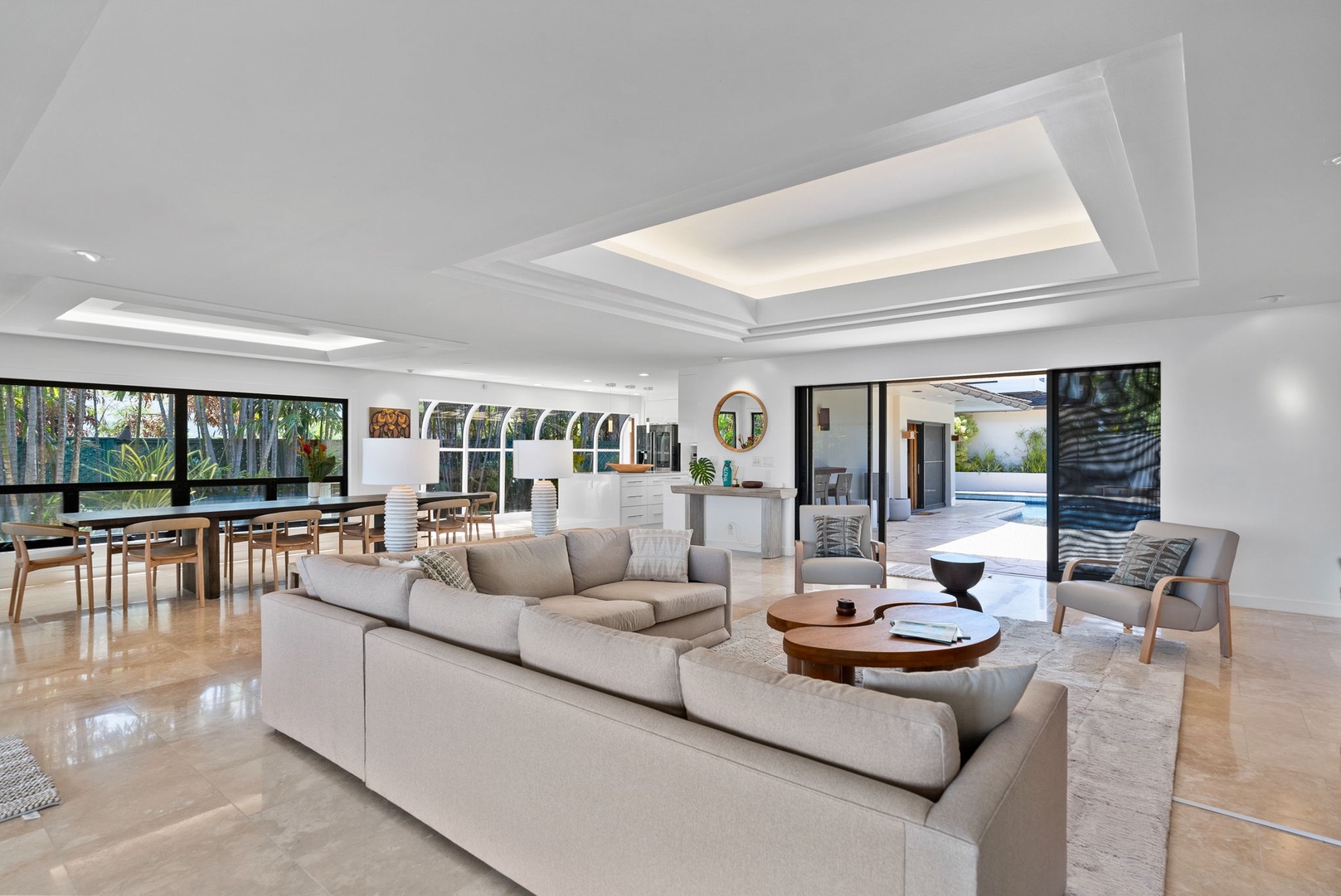 Honolulu Vacation Rentals, The Lagoon House 3BR - Open-plan living area connecting seamlessly to the pool lanai and outdoor space.