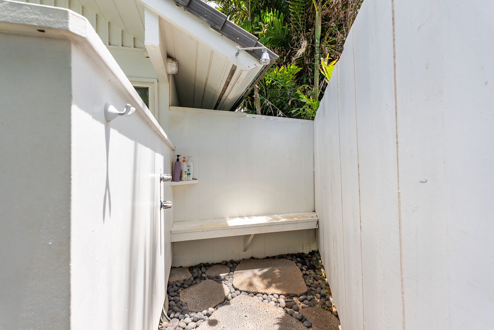 Waianae Vacation Rentals, Ma'ili Blue Estate - Step into your private outdoor shower sanctuary, where natural stone floors and tropical greenery create a spa-like escape.