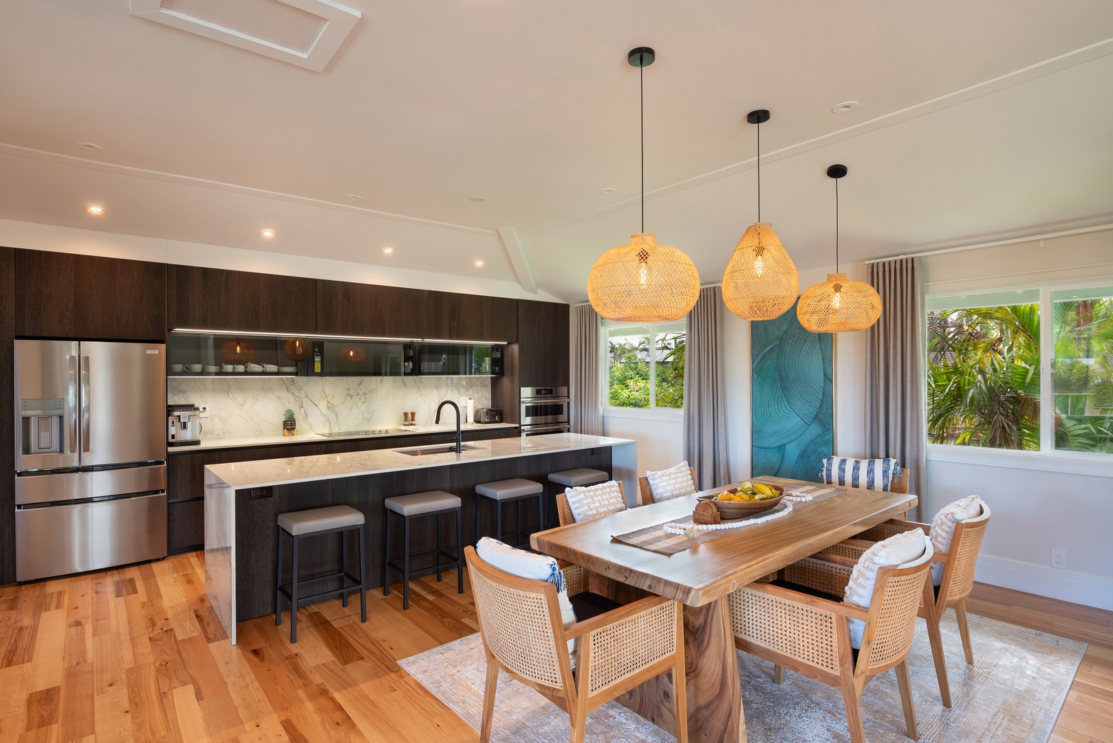 Princeville Vacation Rentals, Hihimanu House - Elegant dining room with pendant lights and a welcoming ambiance.