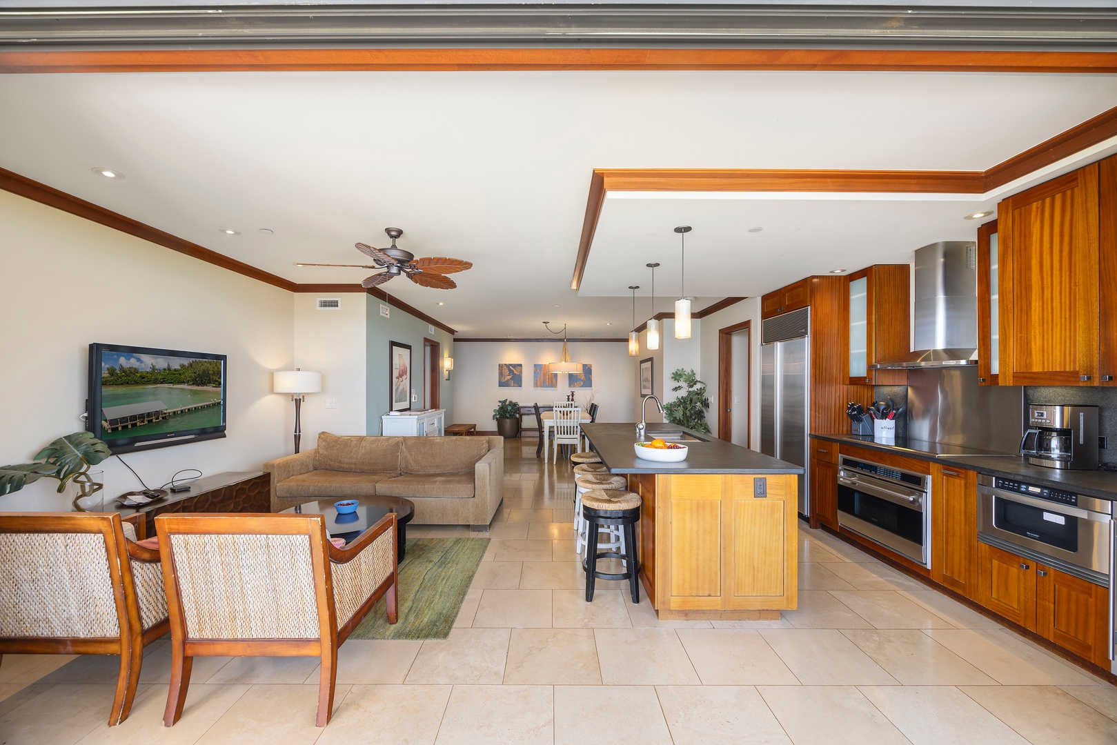 Kapolei Vacation Rentals, Ko Olina Beach Villas B609 - Unwind in your elegant open-concept space where warm wood finishes meet modern comfort—cook, relax, and make memories in this beautifully appointed retreat.