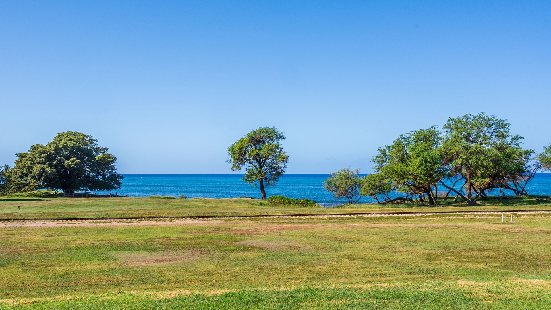 Kapolei Vacation Rentals, Kai Lani 24B - Bright blue skies and vast greenery.