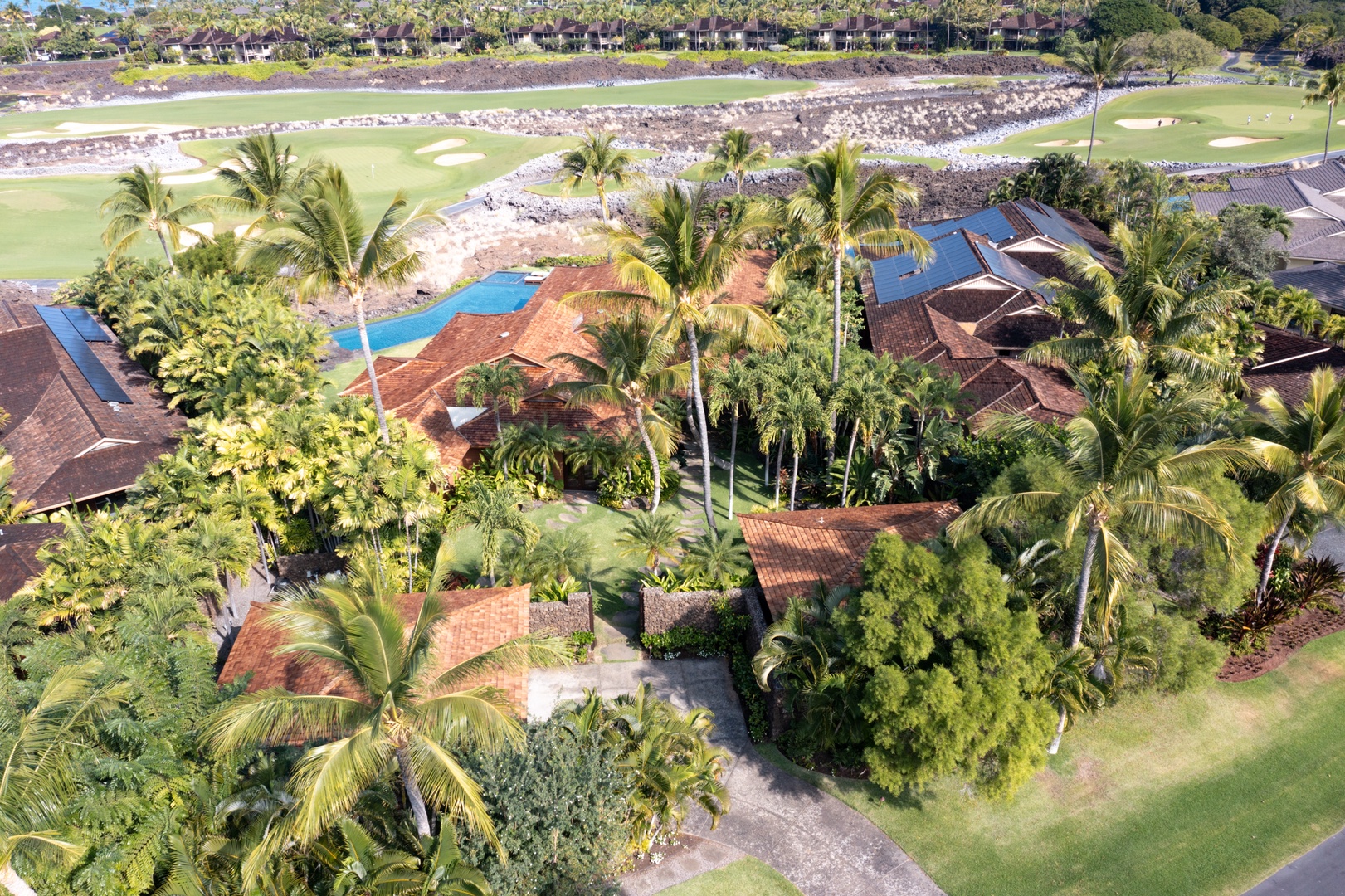 Kailua Kona Vacation Rentals, 5BD Ke Alaula Estate (144) at Hualalai Resort - Close-up aerial showing estate design, palm canopy, and fairway alignment.