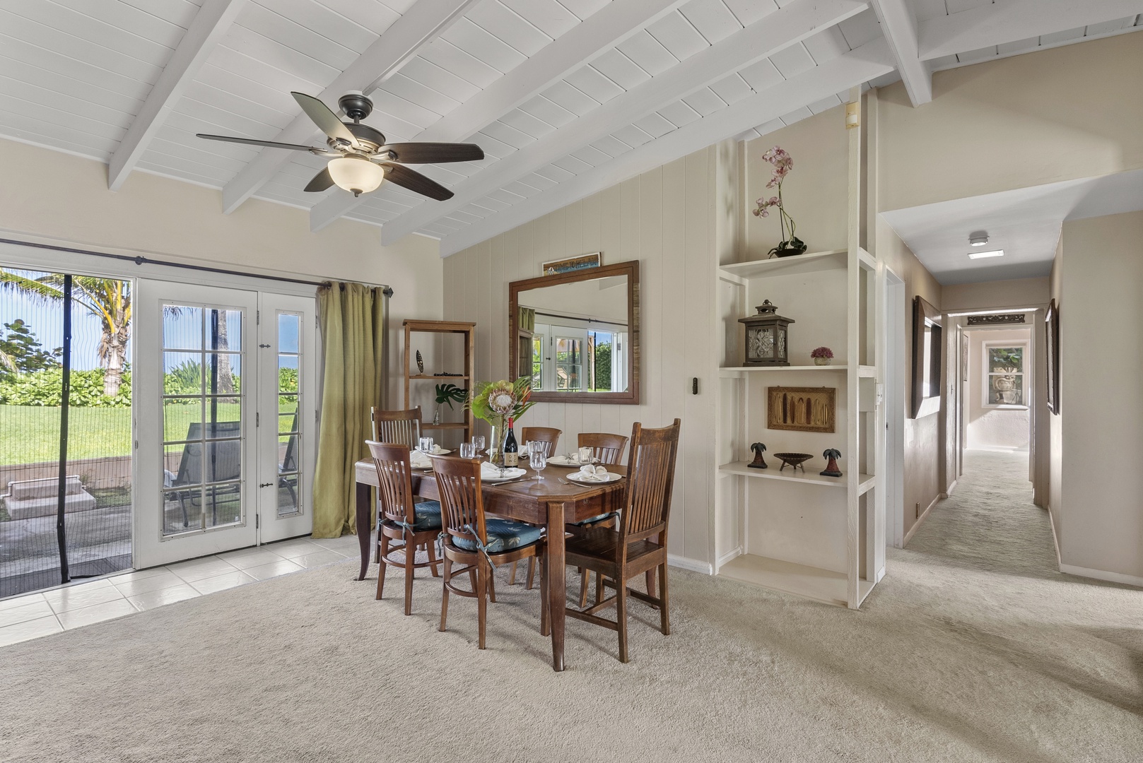 Haleiwa Vacation Rentals, North Shore Beachfront Resort - Dining area with seating for six and access to the lanai.