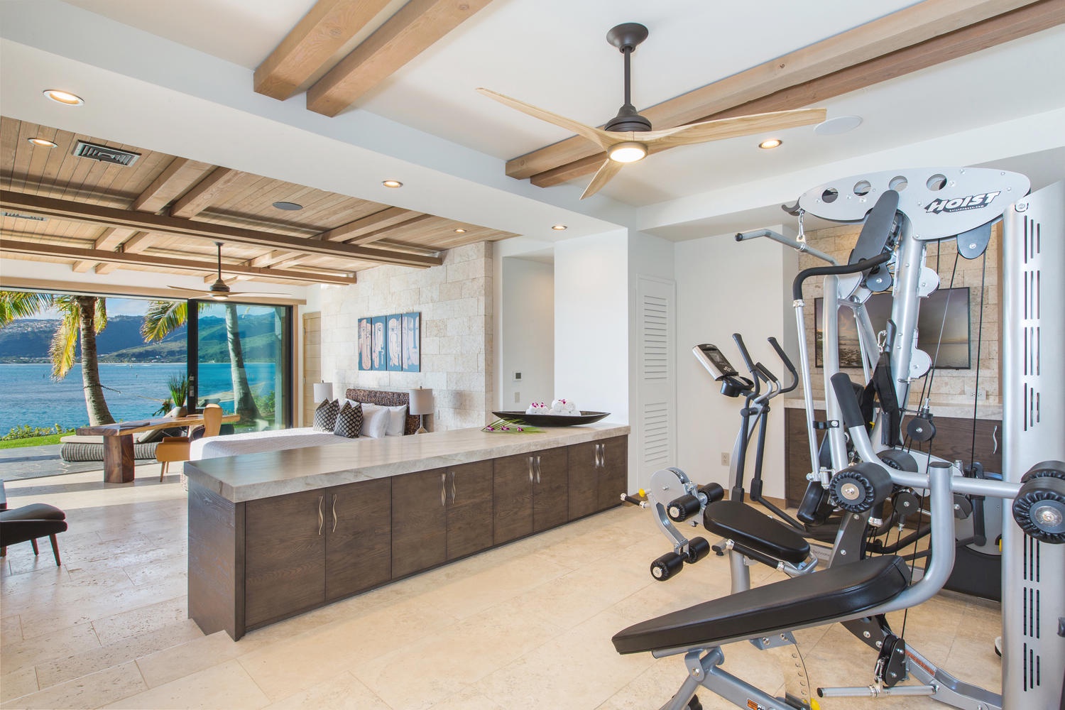 Honolulu Vacation Rentals, Ocean House - Fitness room and downstairs bedroom.