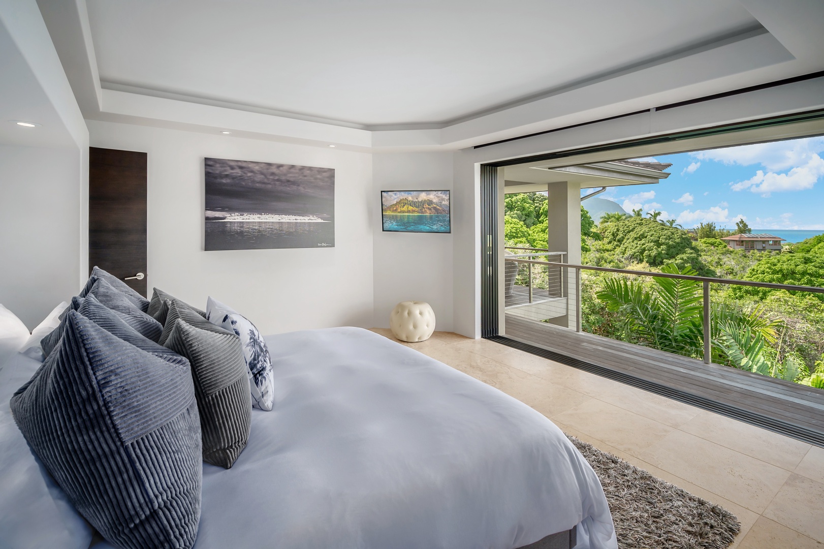 Princeville Vacation Rentals, Hanalei Plantation Villa - Spacious primary suite featuring serene ocean views, perfect for a peaceful retreat.