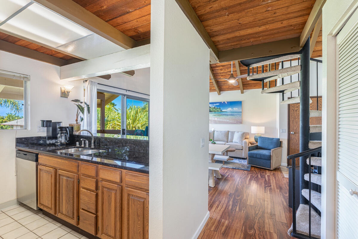 Princeville Vacation Rentals, Hale Ho'omaka - View from kitchen into living area, showing the seamless flow of the layout.