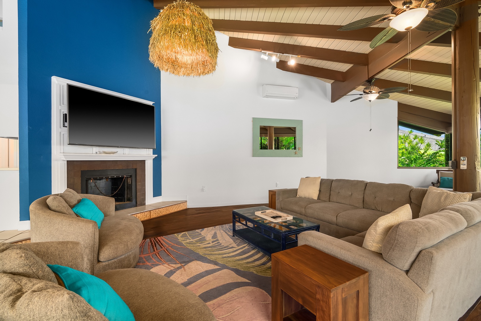 Princeville Vacation Rentals, Mauna Kai 7B - Wood beams overhead, a deep sectional below, and nowhere better to land after a day outside.