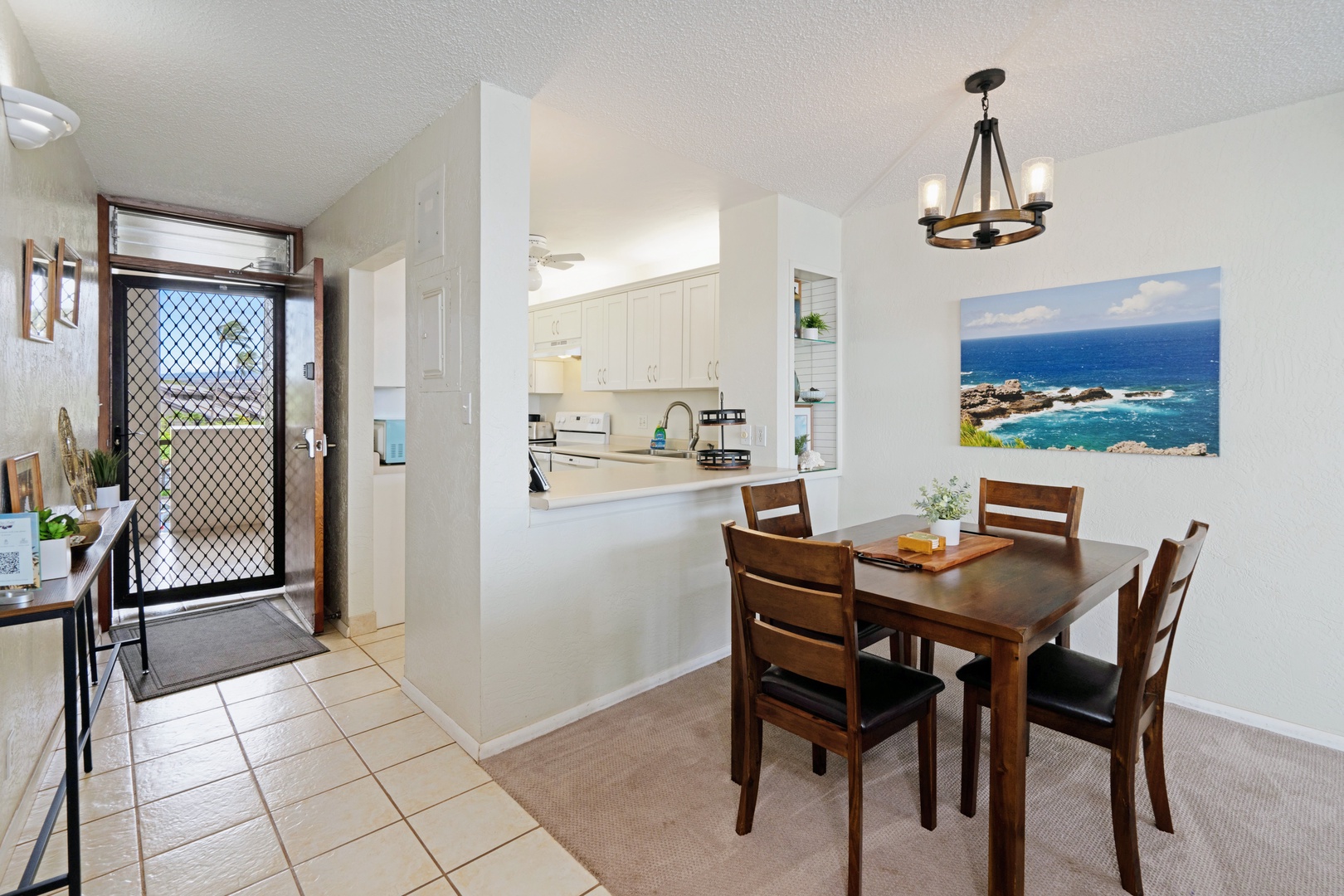 Kihei Vacation Rentals, Menehune Shores 316 - Step through the screen door and the first thing you notice is how close the balcony already feels.