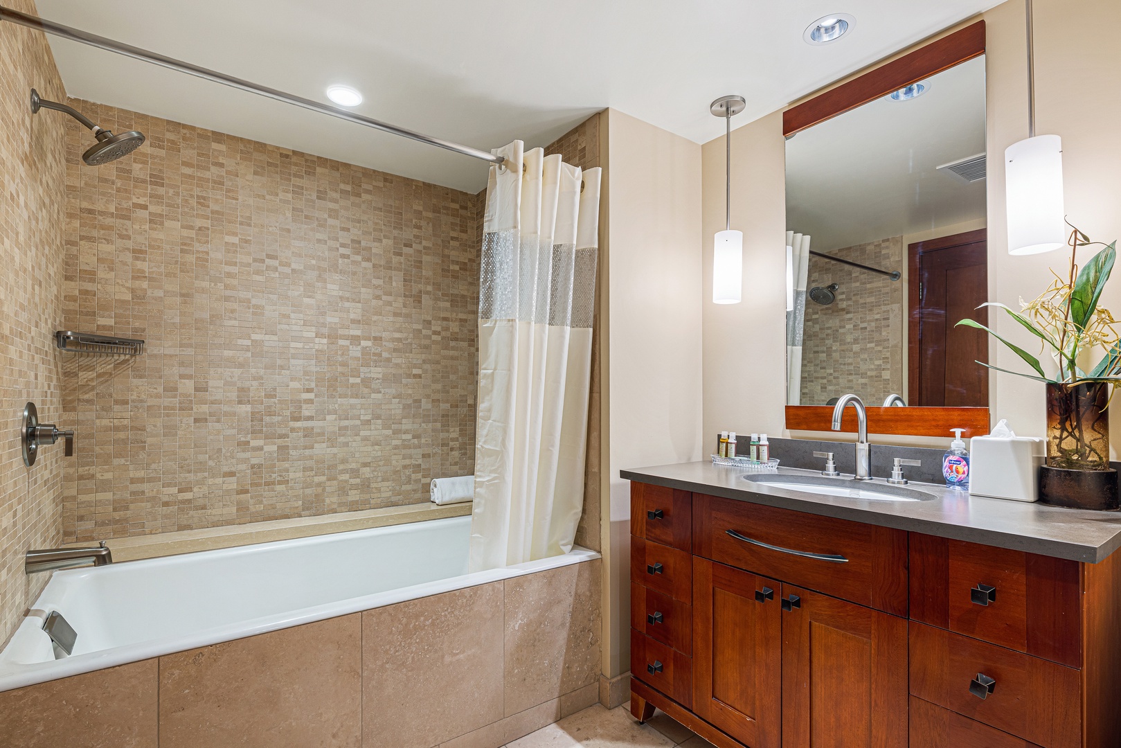 Unwind after your day in your private spa-like bathroom, featuring a soaking tub, walk-in shower, and elegant finishes throughout.