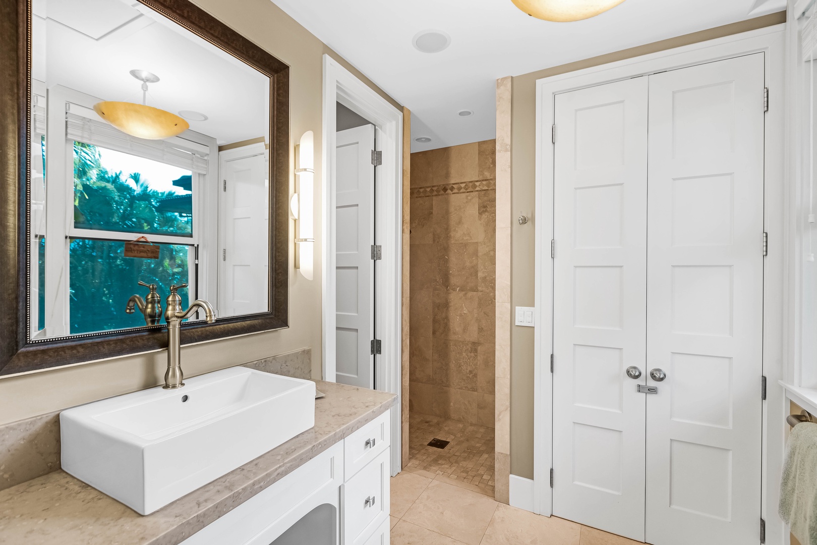 Honolulu Vacation Rentals, Pili Pono - Studio bath with walk-in shower and mirrored vanity.