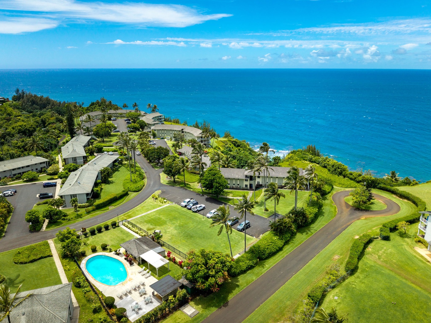 Princeville Vacation Rentals, Alii Kai 7201 - The coastline curves past the community, blue water running to the horizon.