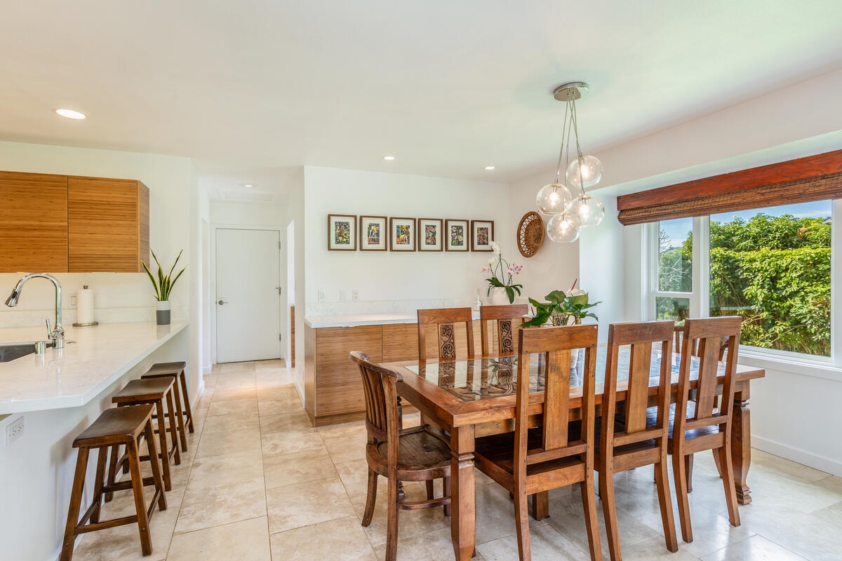 Princeville Vacation Rentals, Luana Hale - Door to the garage and laundry area and half bath next to the dining area