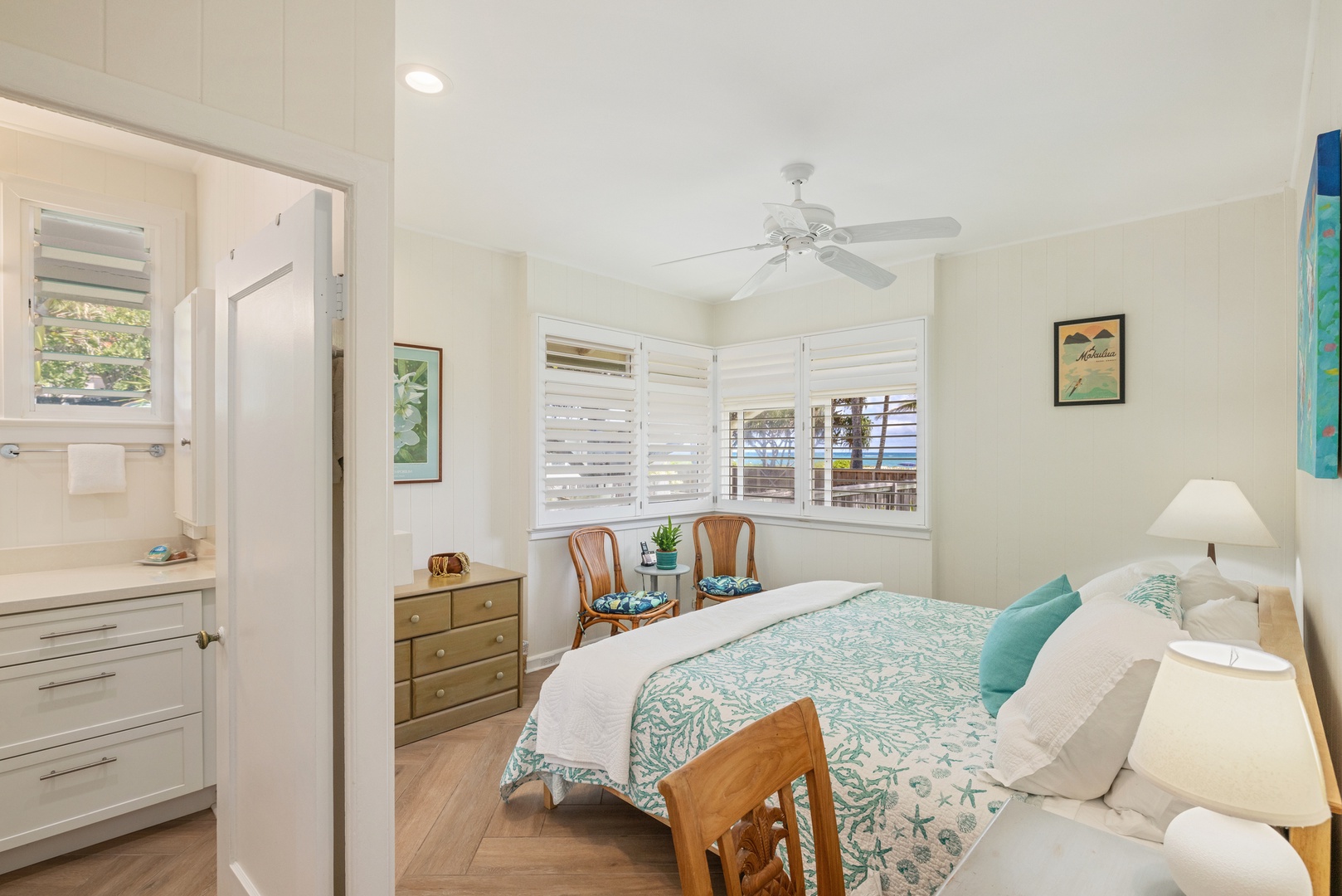 Kailua Vacation Rentals, Hale Moana Lanikai - The space is thoughtfully furnished with a vintage-style dresser and comfortable seating, making it an ideal spot for relaxation after a day of exploration