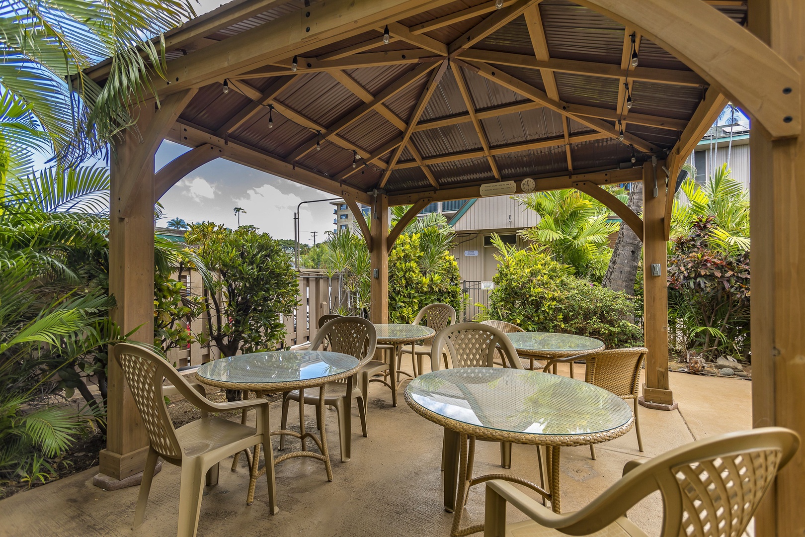 Kihei Vacation Rentals, Kalama Terrace P302 - Round tables under the gazebo roof mean the group doesn't have to split up for cards.