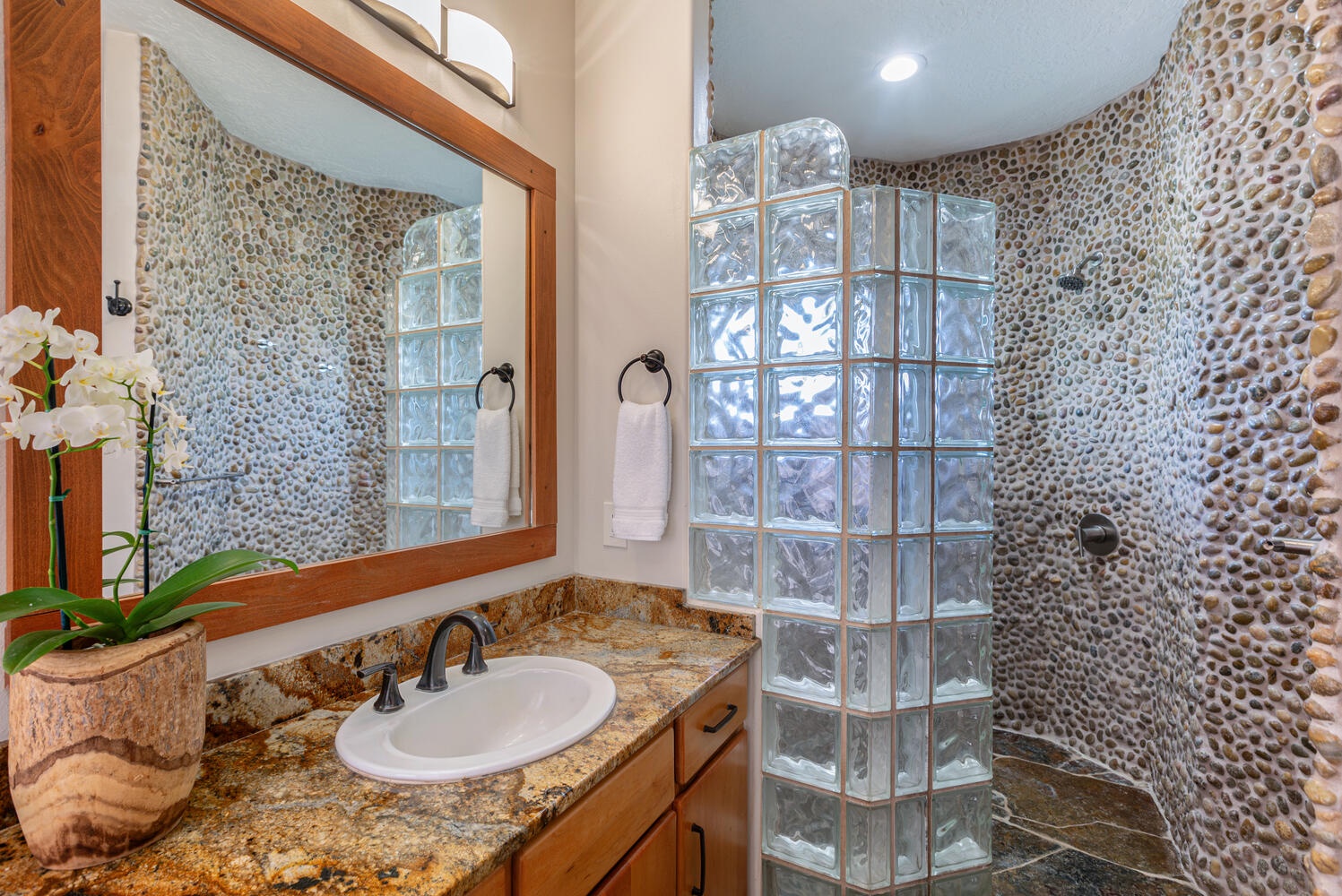 Princeville Vacation Rentals, Pohaku Villa - Primary suite with double head showers.