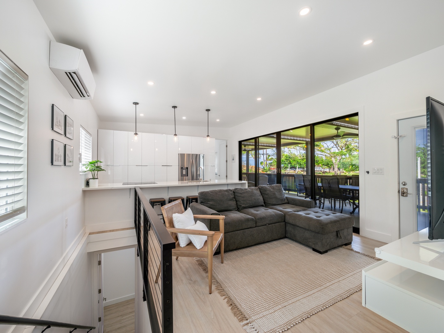 Haleiwa Vacation Rentals, Sunset Beach Island Retreat - The open-concept living room seamlessly flows into the kitchen, creating an inviting space for socializing and relaxation