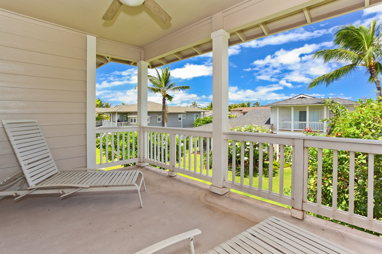 Kapolei Vacation Rentals, Coconut Plantation 1174-2 - The upstairs lanai with lounge chairs and panoramic scenery.