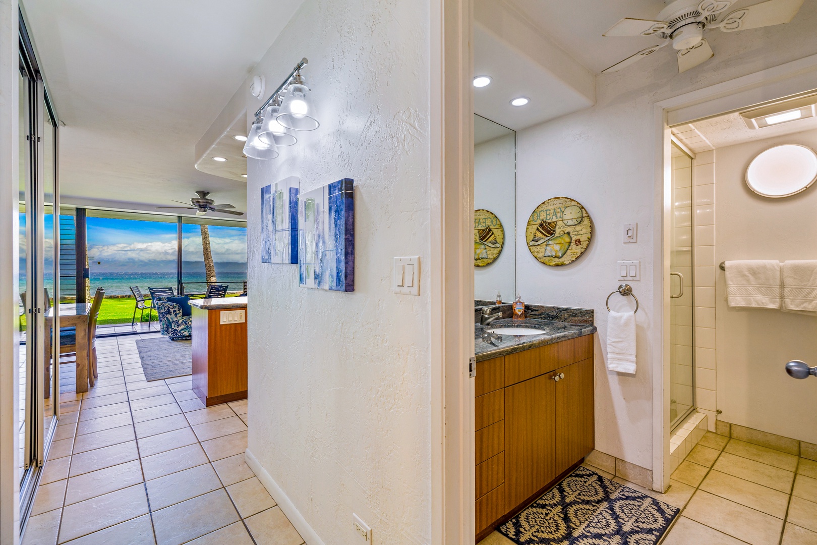 Lahaina Vacation Rentals, Papakea L-106 - Conveniently located near the living space, Papakea L-106’s hallway bathroom features a contemporary vanity and stylish decor