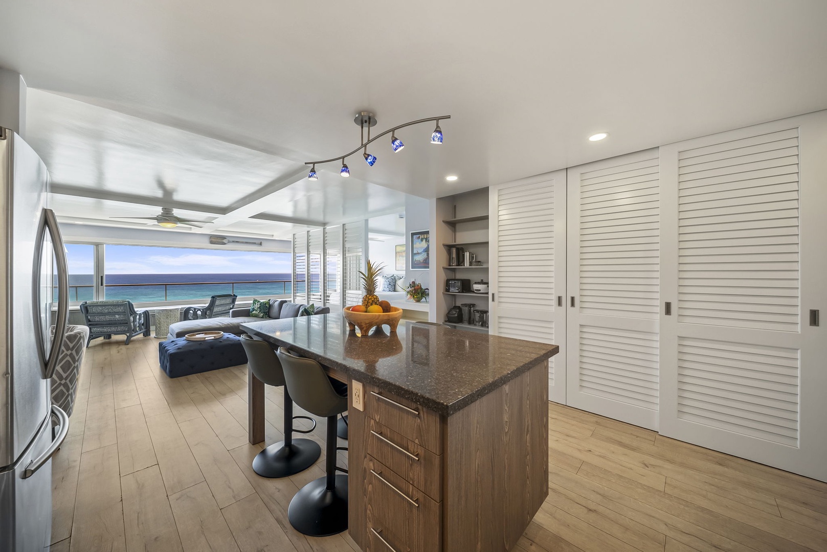 Honolulu Vacation Rentals, Kaimana Tides at Colony Surf - You'll love cooking in this modern kitchen while gazing at stunning ocean views through the open panoramic windows.