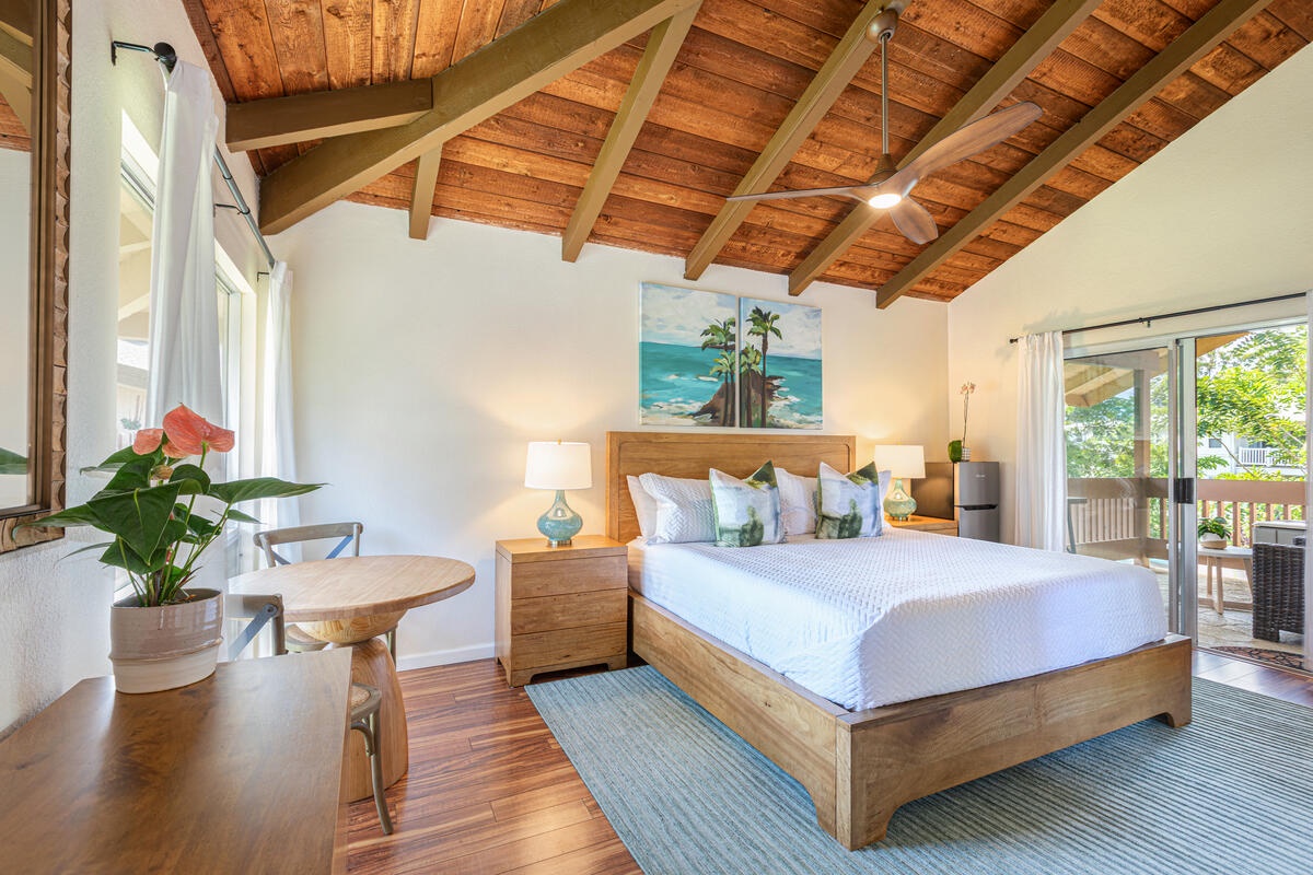 Princeville Vacation Rentals, Hale Ohana Ho'omaka - Second primary king bedroom filled with light and nature views. Opens to private lanai for indoor-outdoor comfort.
