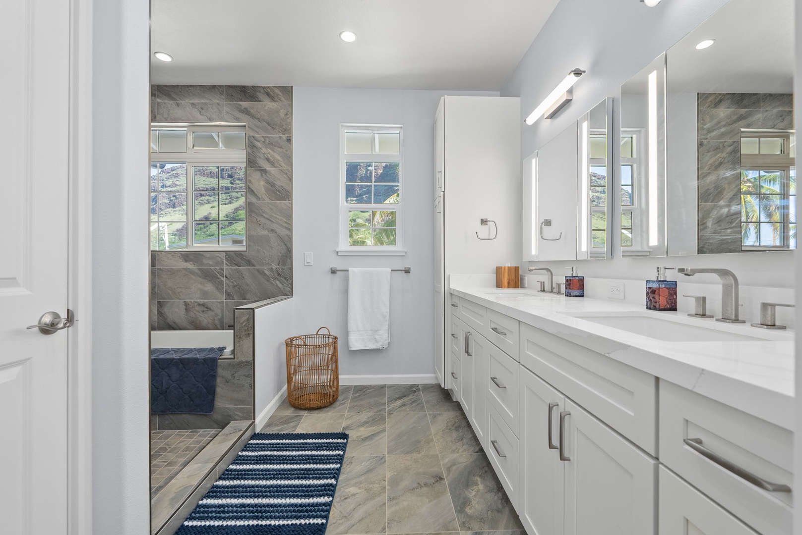 Waianae Vacation Rentals, Oceanfront Luxury Dream Estate - Spa-inspired en-suite bathroom with floor-to-ceiling tile and scenic window views.