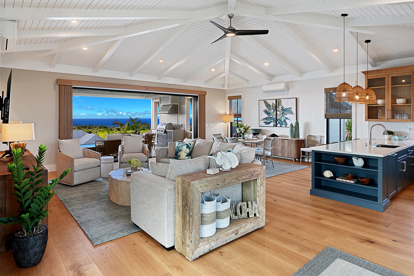 Koloa Vacation Rentals, Hali'a Mai - Soft seating gathers under vaulted white ceilings, the kind of room people drift back to after the beach.