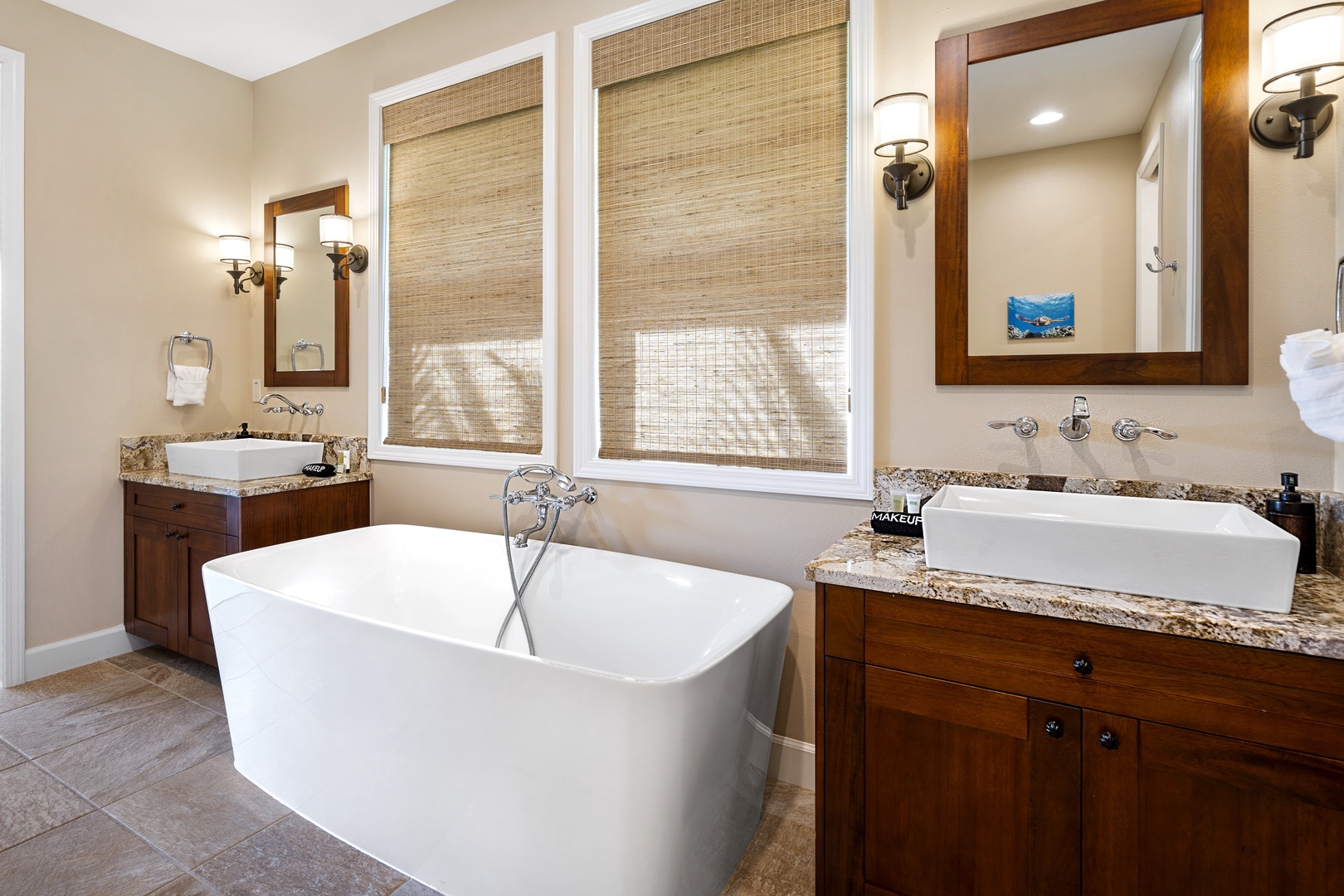 Kailua Kona Vacation Rentals, Kona Blue Vacations Holua Kai - The ensuite primary bath at Kona Blue Vacations Holua Kai features dual vanities and a soaking tub.