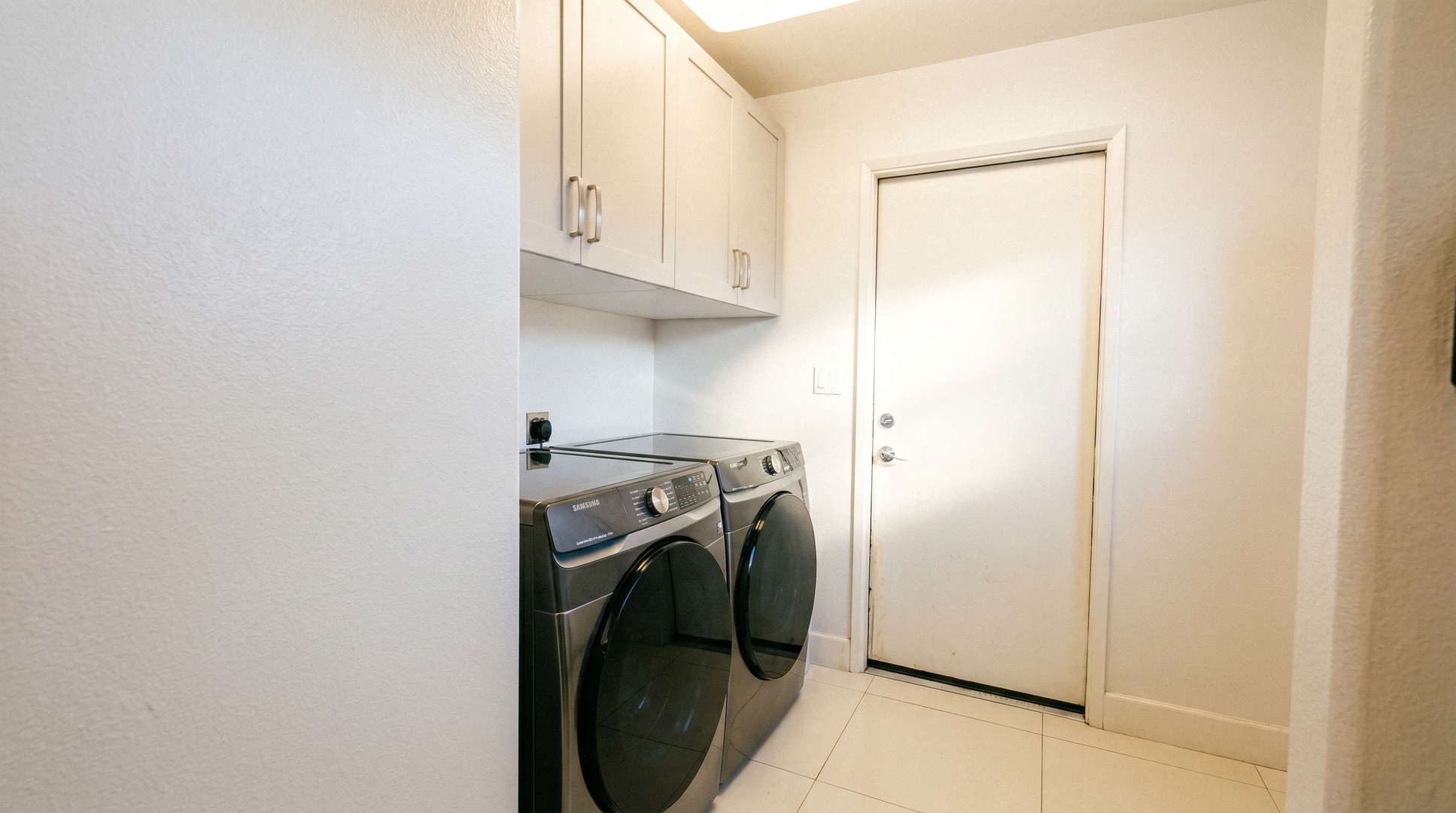 In-unit laundry with a front-load washer and dryer for packing light and washing sandy towels.