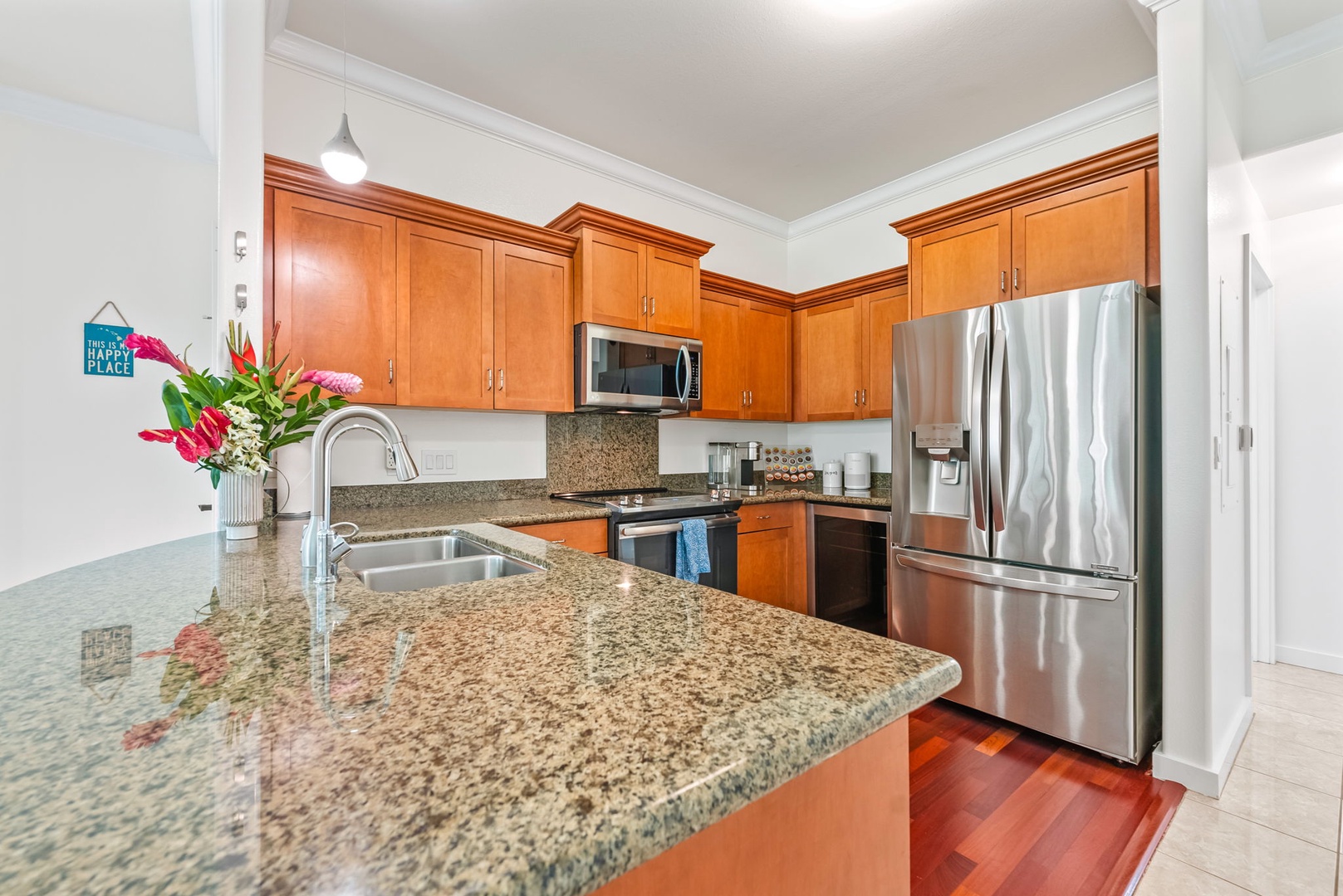 Kapolei Vacation Rentals, Kai Lani Luxury 6D - Beautiful granite countertops and wood cabinetry create a warm and welcoming space in this well-equipped kitchen.