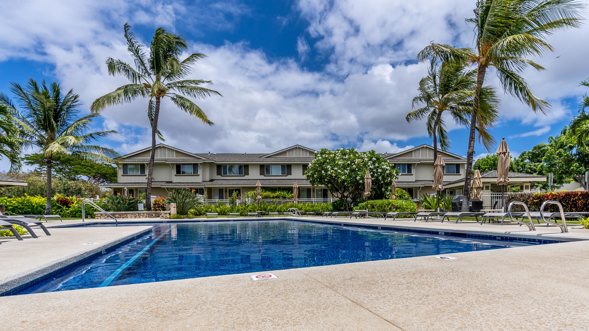 Kapolei Vacation Rentals, Hillside Villas 1508-2 - Relax by the community pool with your favorite book.
