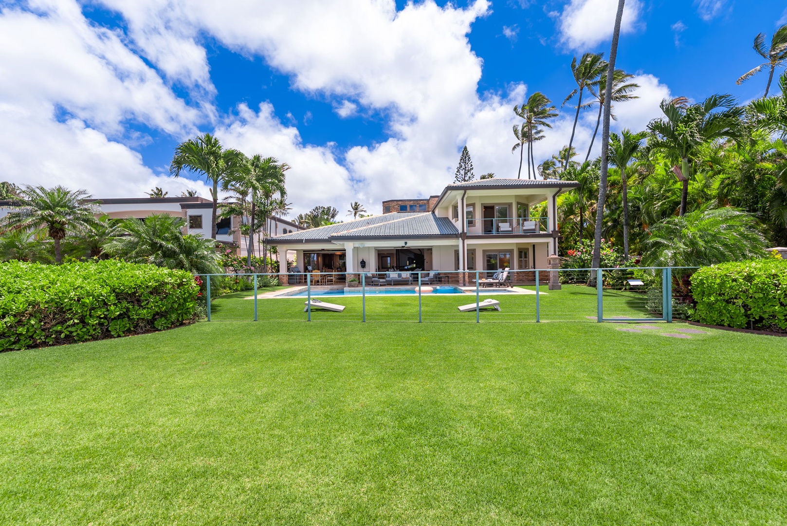 Honolulu Vacation Rentals, Maunalua Estate - Expansive green space and towering palms create a calm setting just steps from the shoreline.