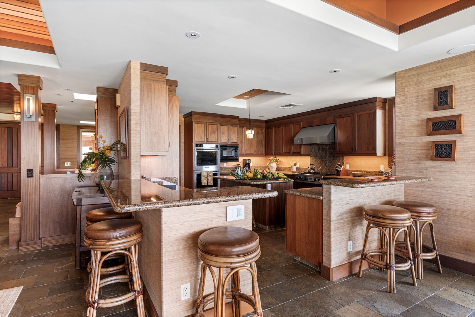 Kailua Kona Vacation Rentals, 3BD Pakui Street Estate (149) at Hualalai Resort - Grab a stool at the island and keep the cook company while dinner comes together.