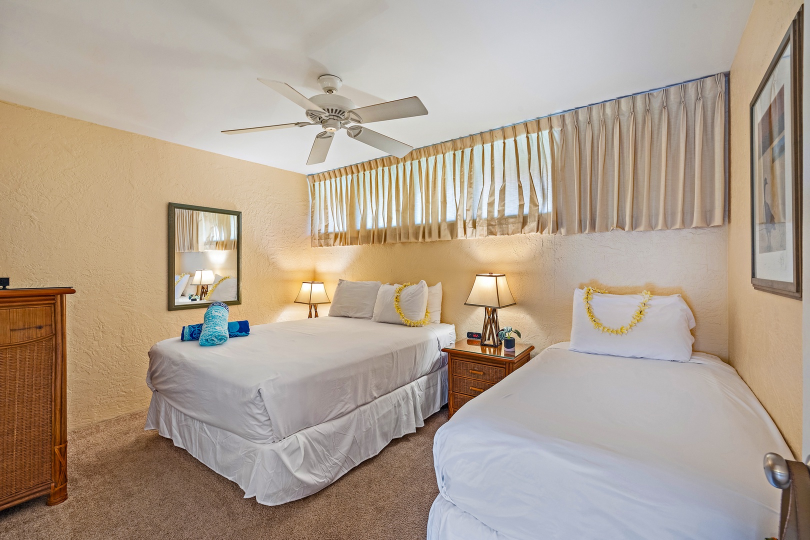 Lahaina Vacation Rentals, Papakea G-306 - The cozy guest bedroom offers both a queen and twin bed, making it an ideal space for families or friends traveling together.