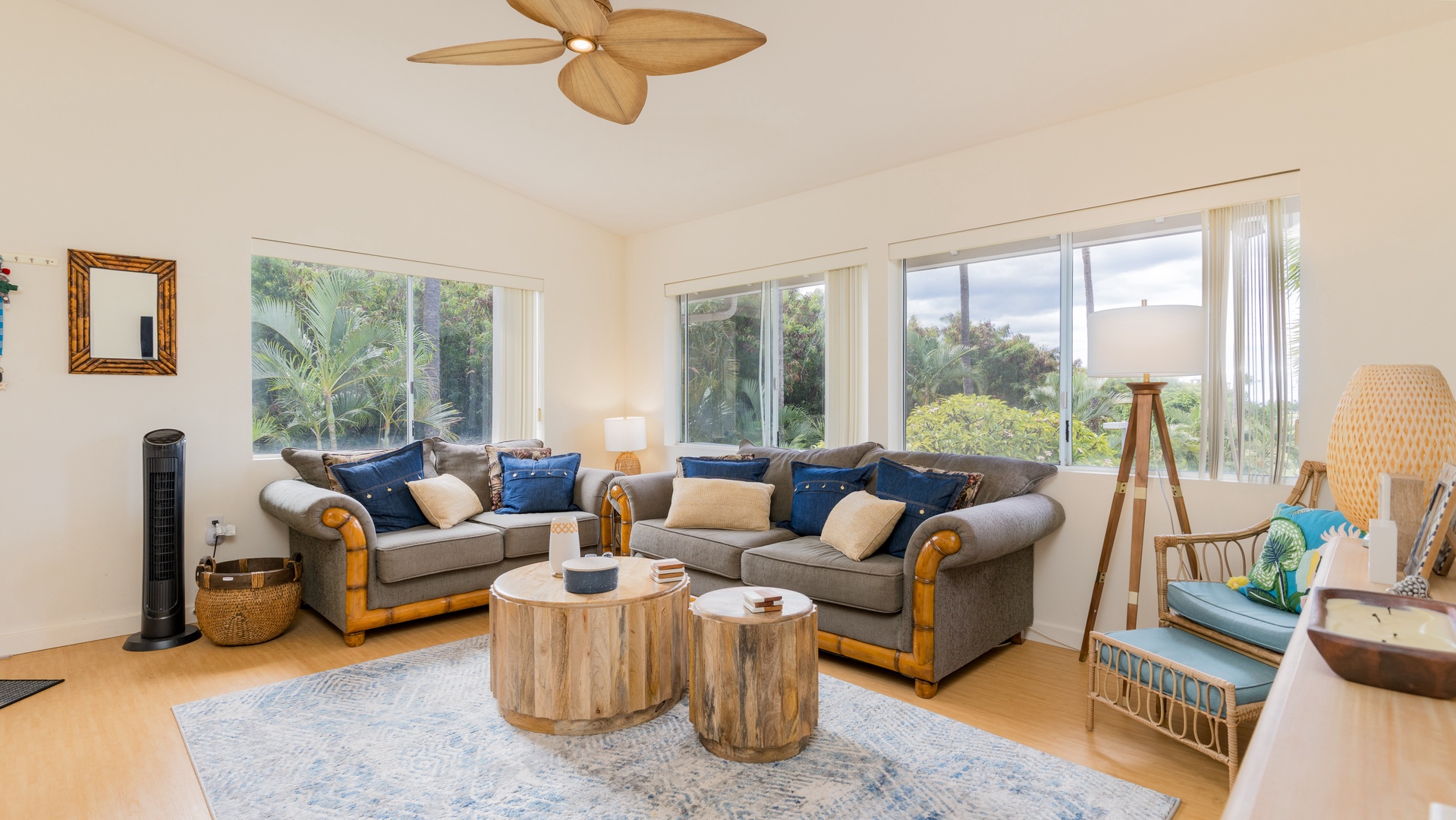 Kapolei Vacation Rentals, Fairways at Ko Olina 4A - Sink into the plush seating in the living area surrounded by natural wood tones.