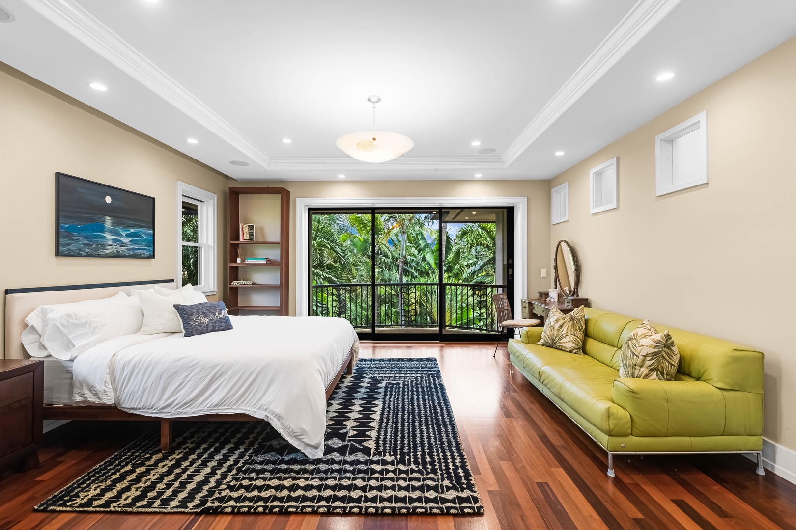 Honolulu Vacation Rentals, Pili Pono - Spacious guest suite with king bed, seating area, and lush garden views.
