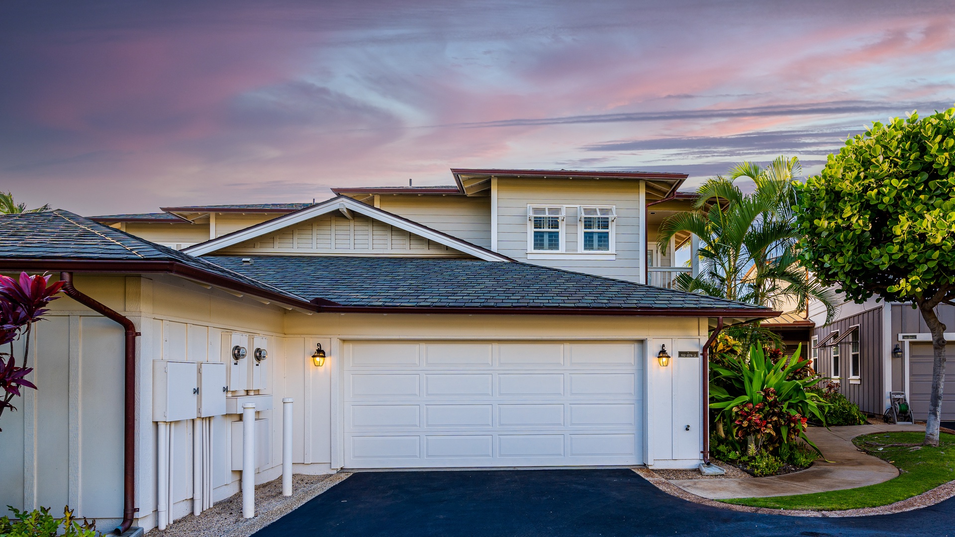 Kapolei Vacation Rentals, Coconut Plantation 1174-2 - The paved area and garage of the home.