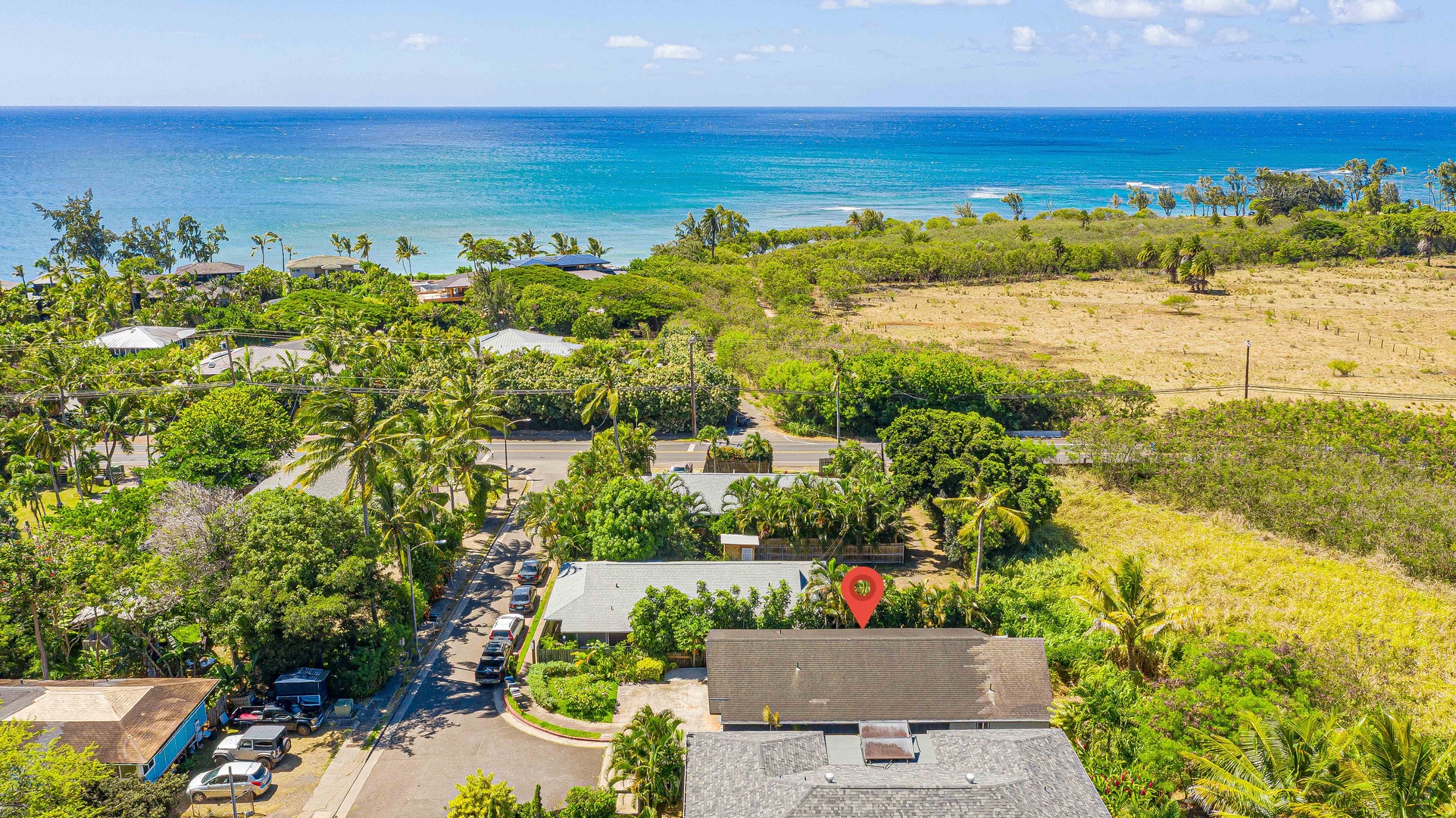 Haleiwa Vacation Rentals, Velzey Villa (3B Vacation Home) - Overhead shot showing the villa nestled among lush greenery, steps from the sand.