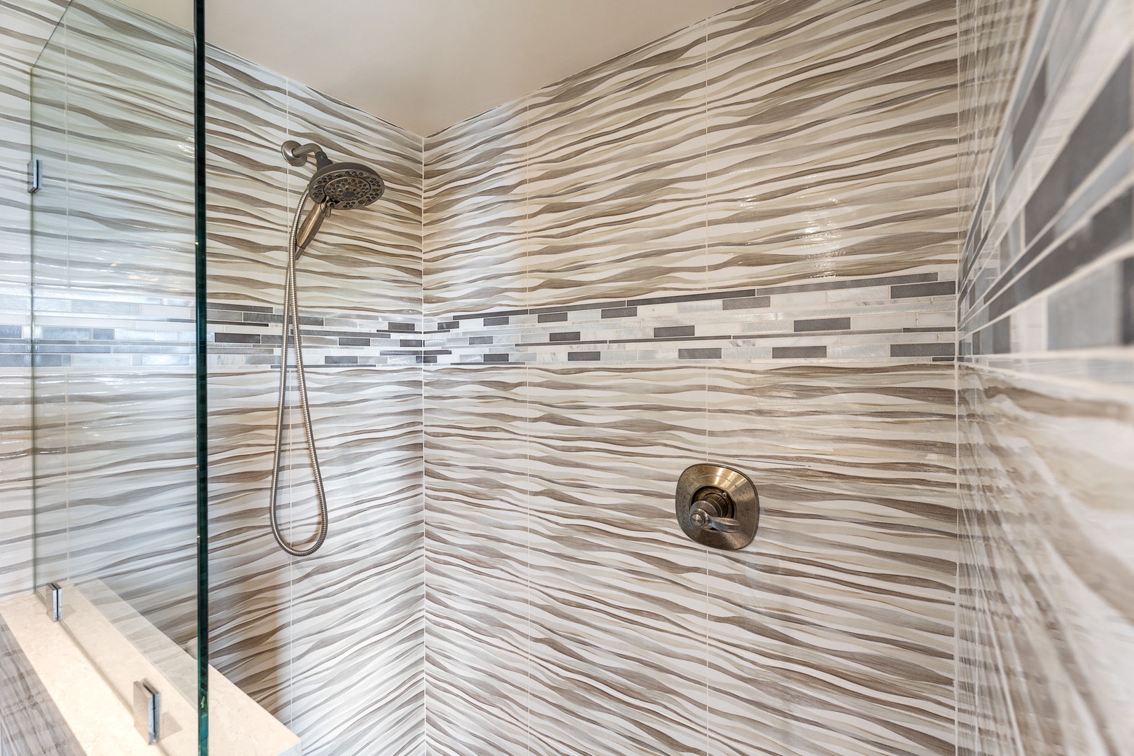 Kailua Kona Vacation Rentals, Royal Kahili 401A - Stylish walk-in shower with contemporary tilework and a rainfall showerhead.