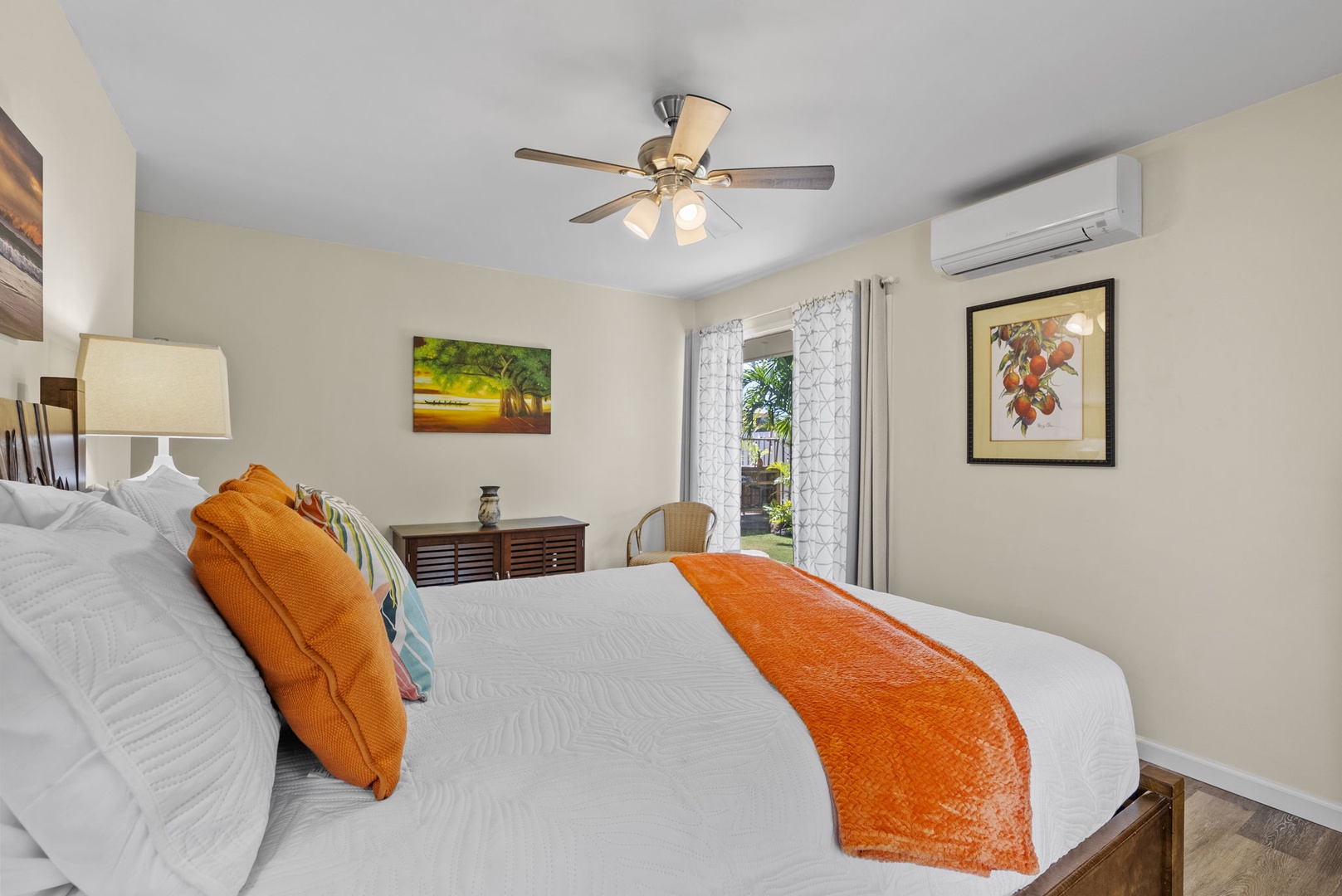 Kailua Vacation Rentals, Hale Aloha - Primary suite boasting a luxurious ambiance, complete with an AC and tranquil views outdoors.