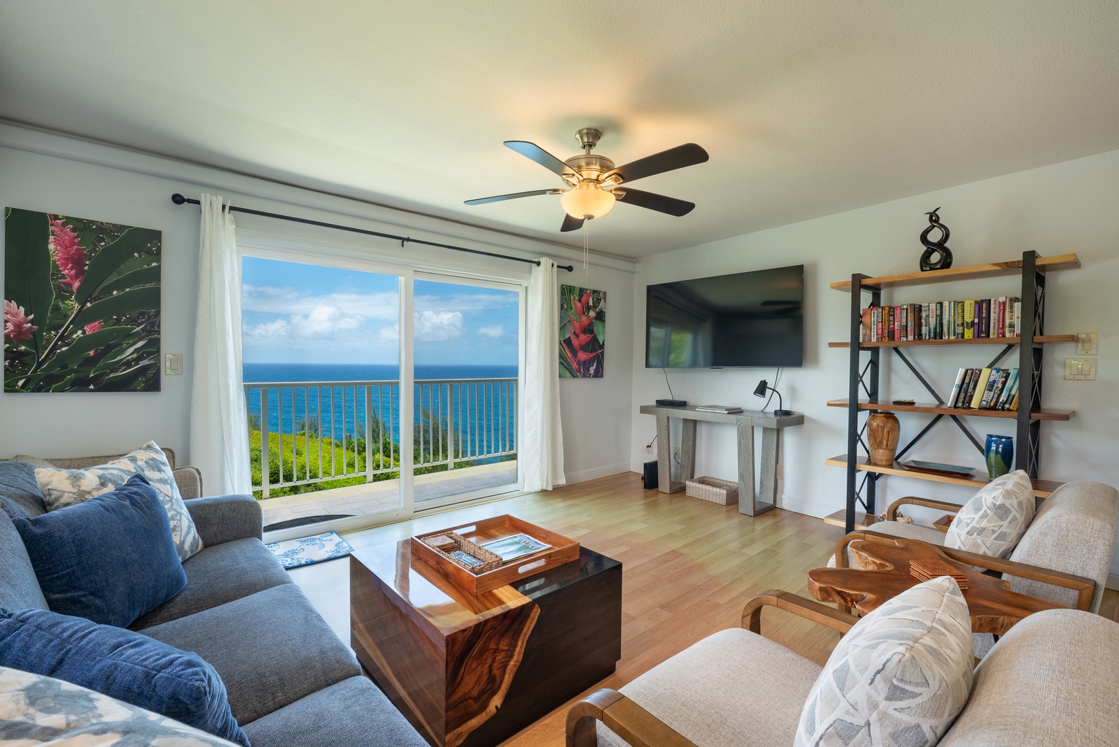 Princeville Vacation Rentals, Moana Kai - Sink into the sofa with the Pacific filling the sliders from where you sit.