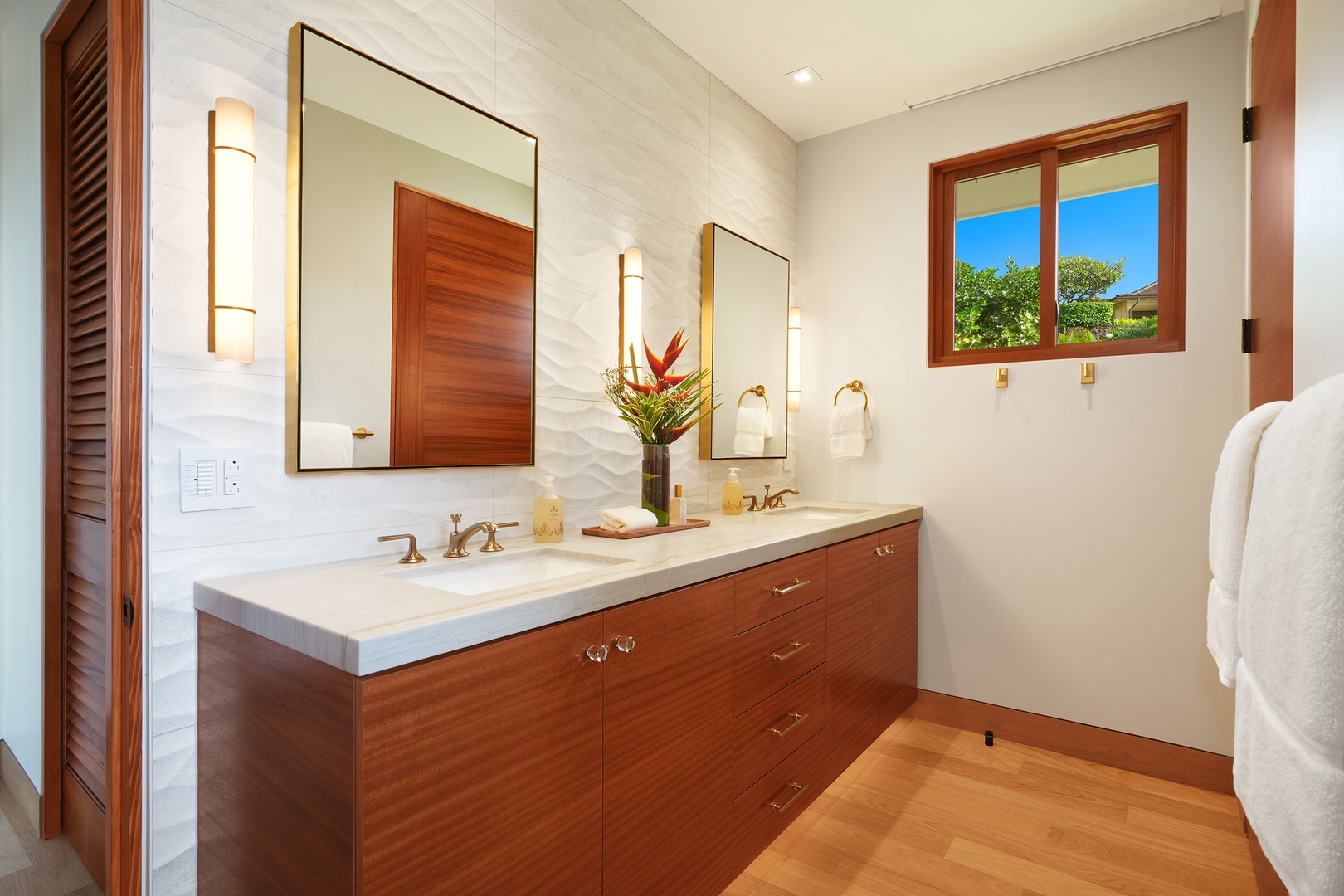 Koloa Vacation Rentals, Hale Kai'Opua - Modern bathroom featuring dual sinks and warm wood accents