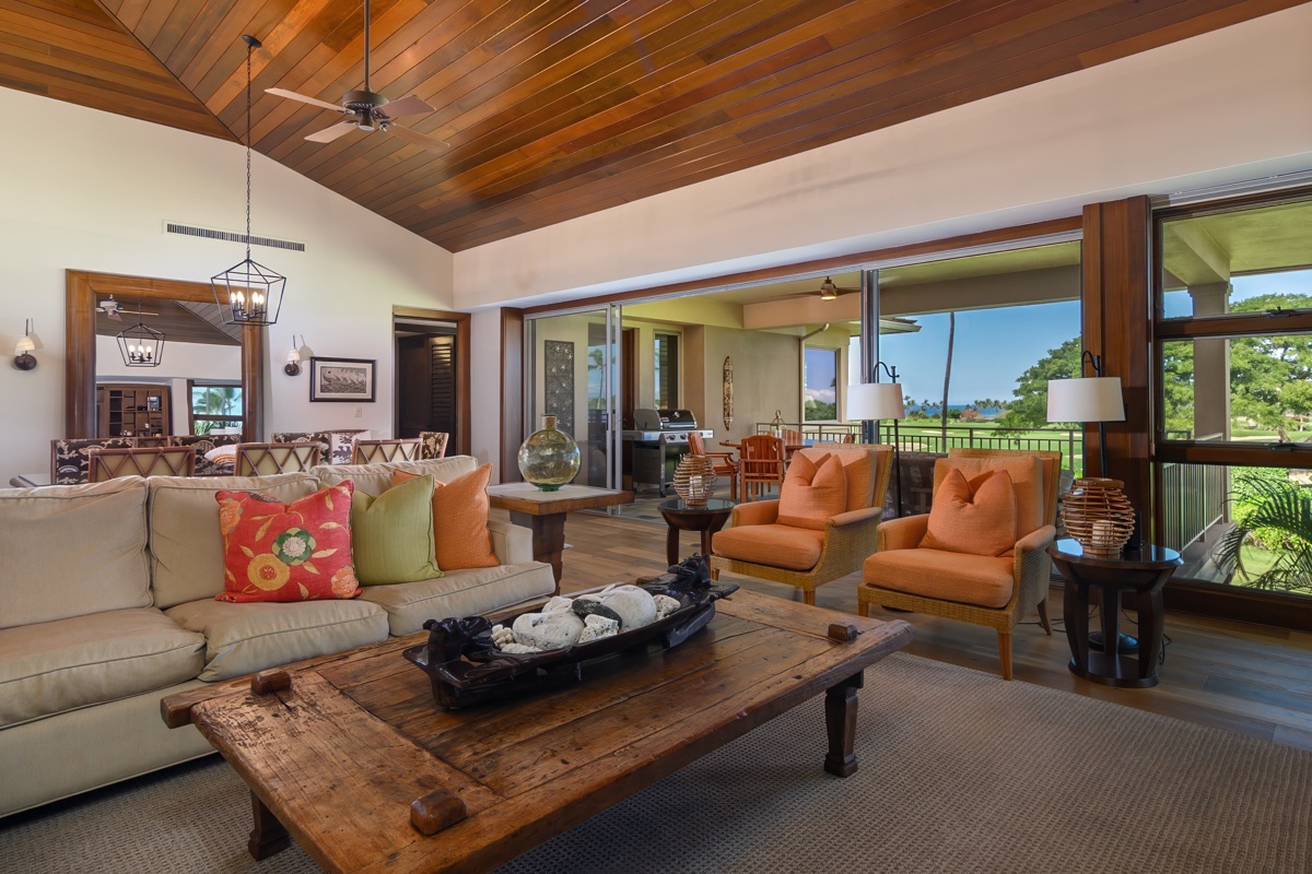 Kailua Kona Vacation Rentals, Fairways Villa 120A - Sink into plush seating beneath gorgeous wood beams while enjoying seamless indoor-outdoor flow to lush tropical views.
