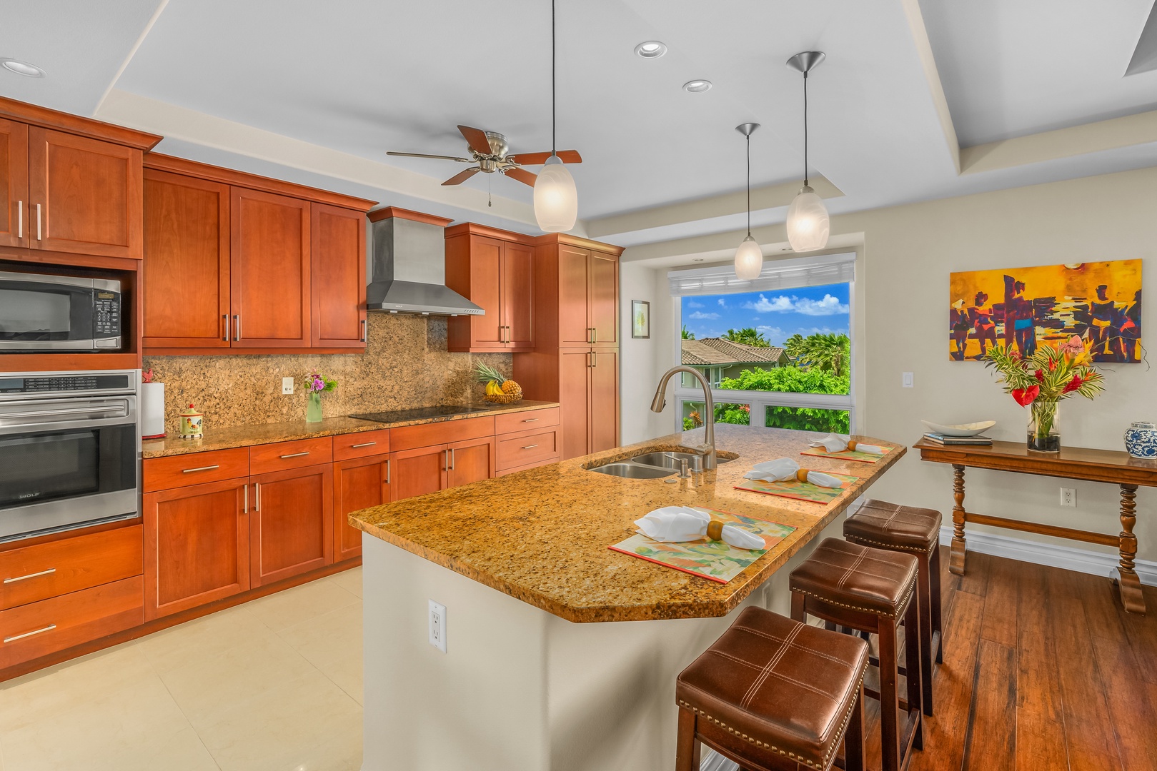 Princeville Vacation Rentals, Noelani Kai - Wide countertops with plenty of cabinets for storage and clutter free culinary space.