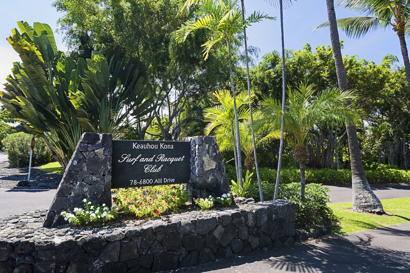 Kailua Kona Vacation Rentals, Keauhou Kona Surf & Racquet 1104 - The Surf and Racquet Club sign sets off the gated, landscaped grounds.